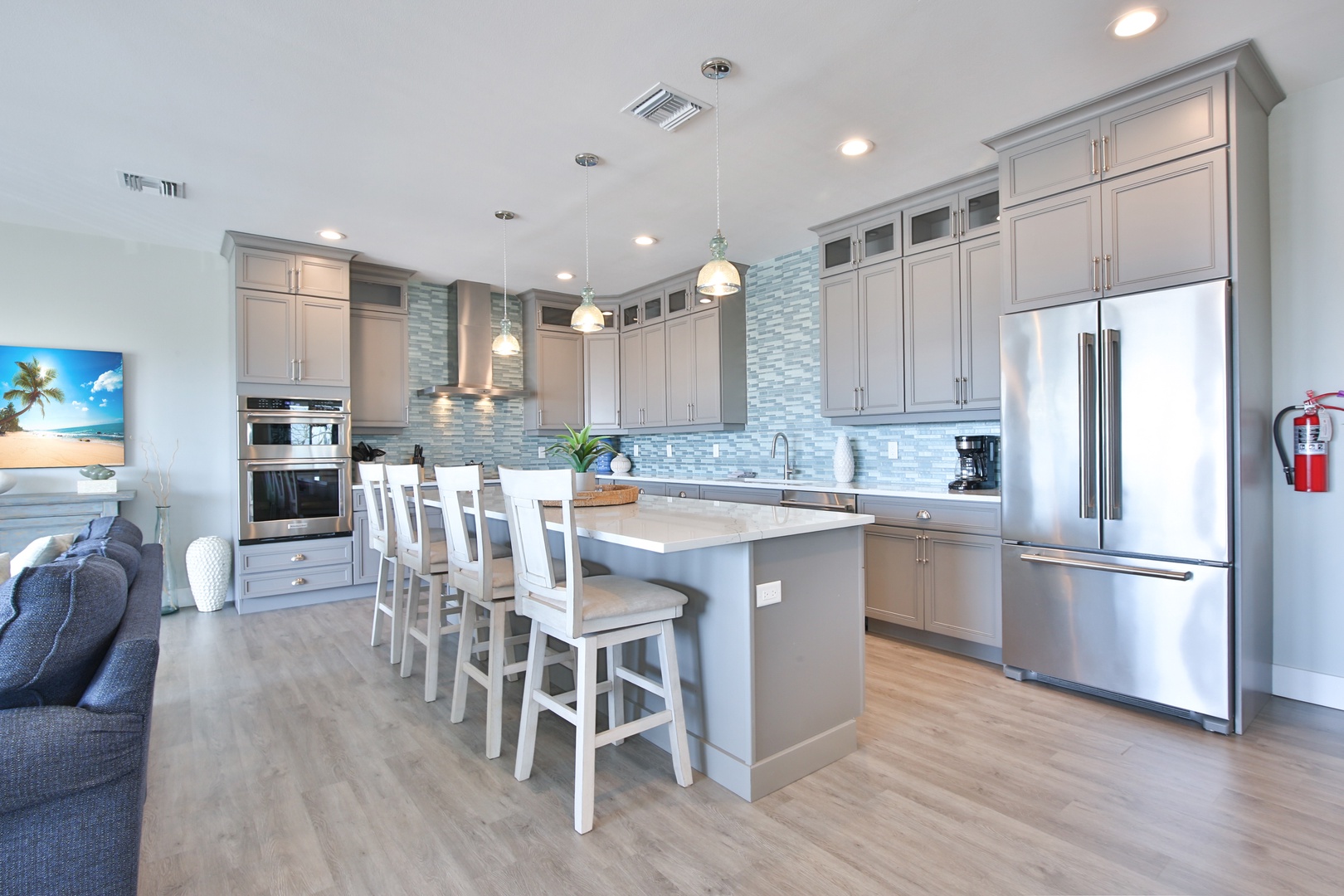 Your gourmet kitchen awaits with quartz counters, stainless appliances, and island seating for memorable meals together.
