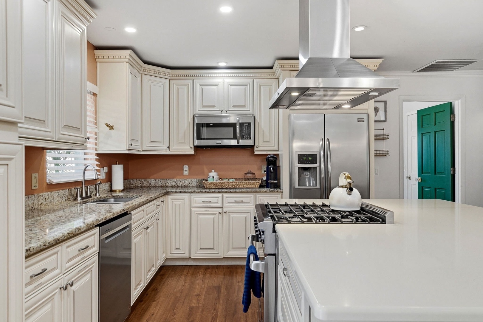 Your gourmet kitchen awaits with granite counters, stainless appliances, and gas range—perfect for creating memorable meals together.