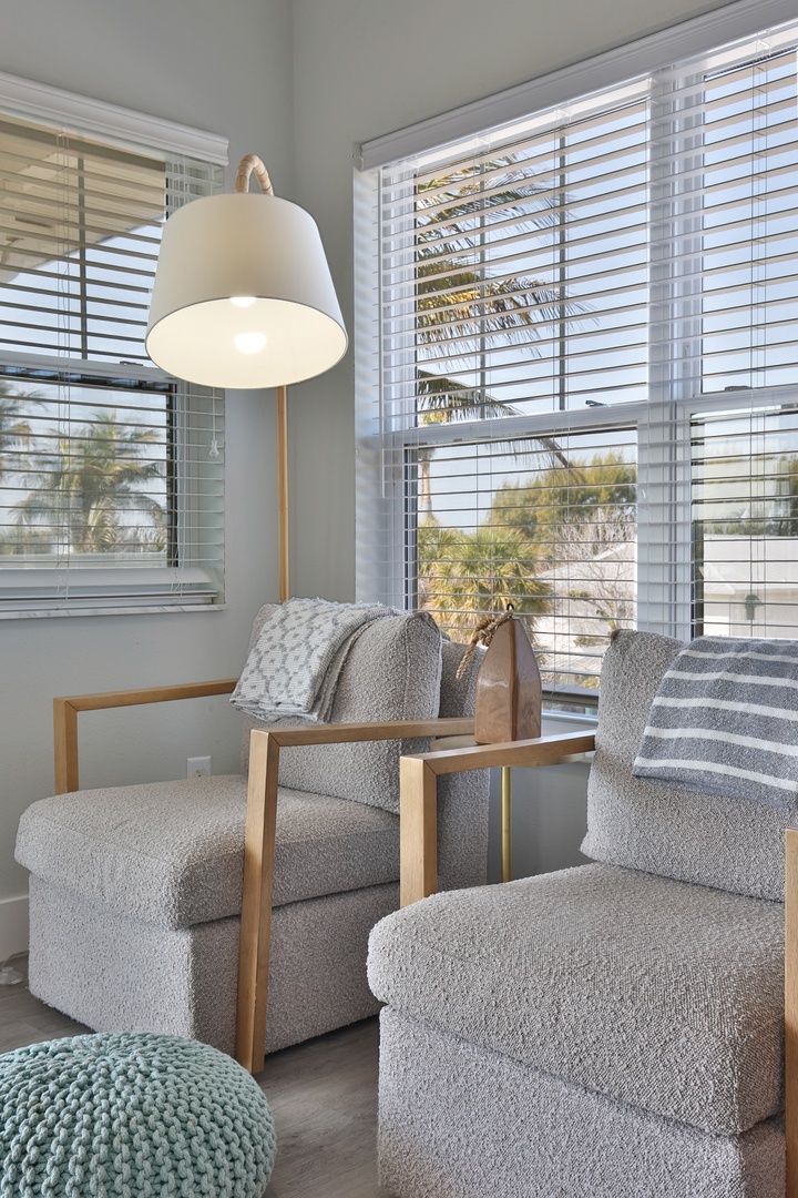 Settle into your cozy reading nook with comfortable armchairs and natural light streaming through.