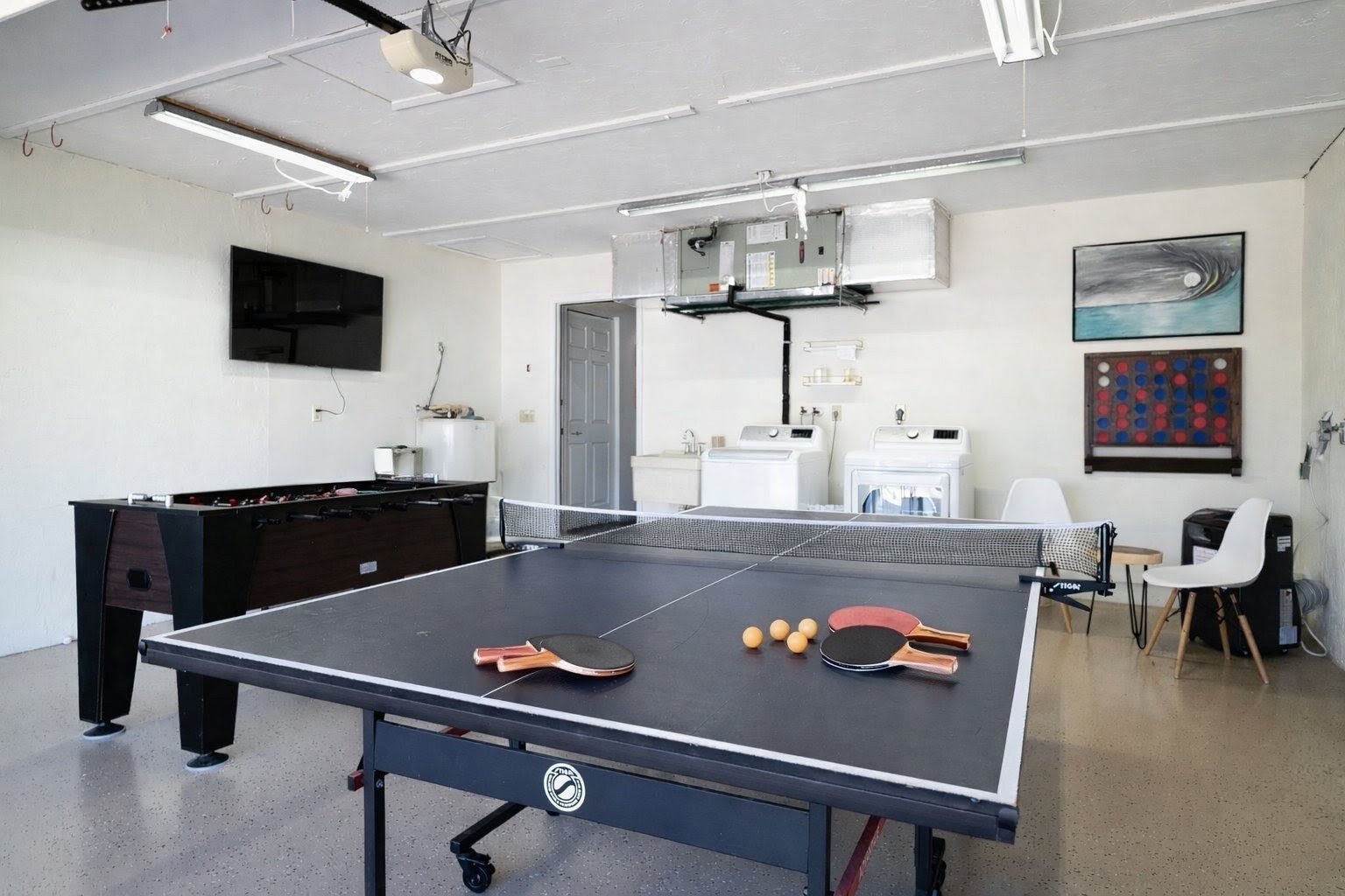 Challenge friends to ping pong or pool in your entertainment space, complete with kitchen, TV, and washer/dryer convenience.