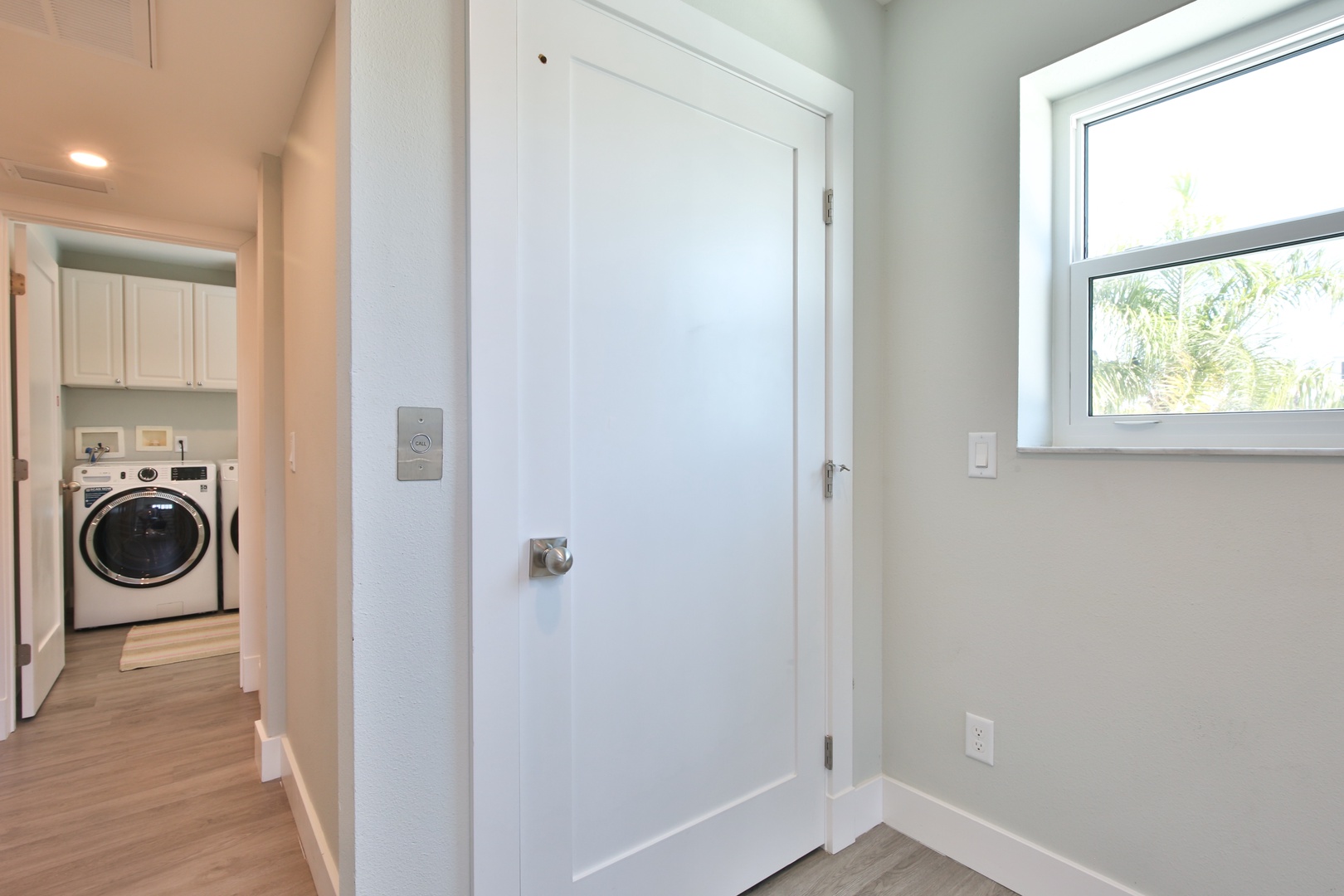 Your bright hallway connects to a fully-equipped laundry room, making extended stays effortless and convenient.