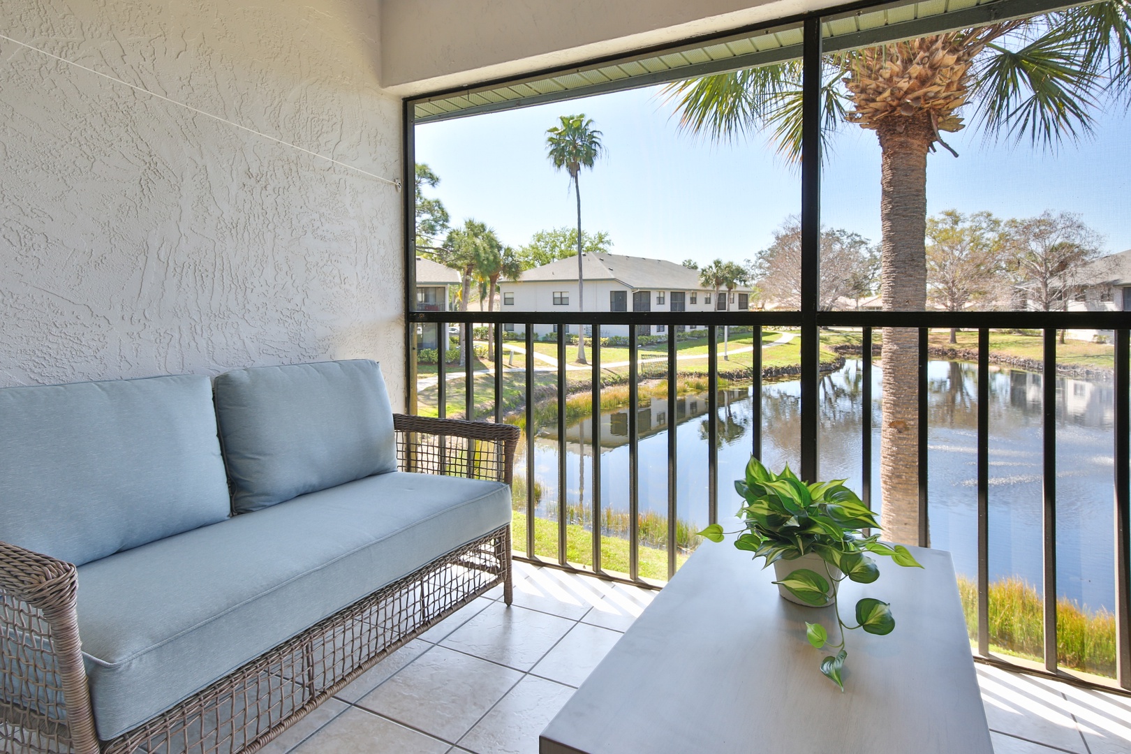 Unwind on your private balcony with serene lake views, comfortable seating, and tropical surroundings creating your perfect retreat.