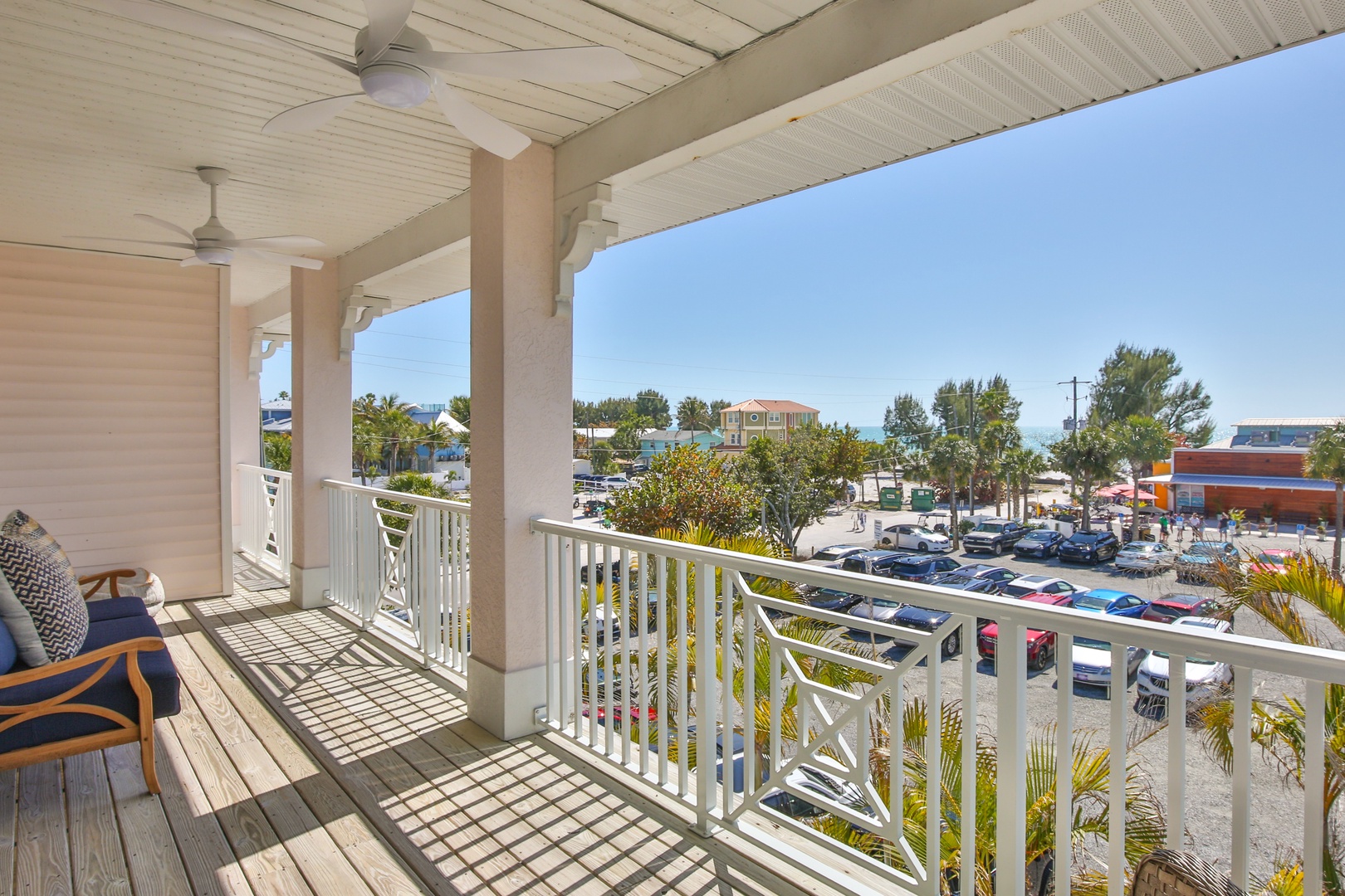 Unwind on your private balcony with comfortable seating and gentle ceiling fans creating the perfect breeze for your morning coffee or evening relaxation.