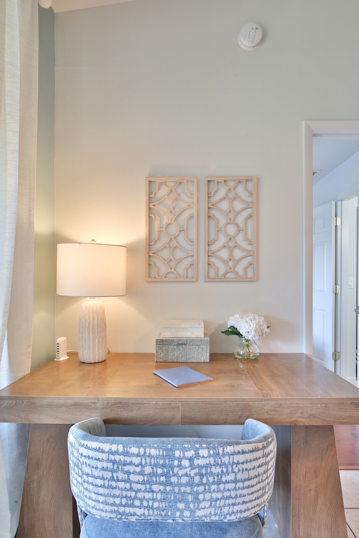 Your dedicated workspace awaits with warm lighting and thoughtful details to inspire productivity during your stay.