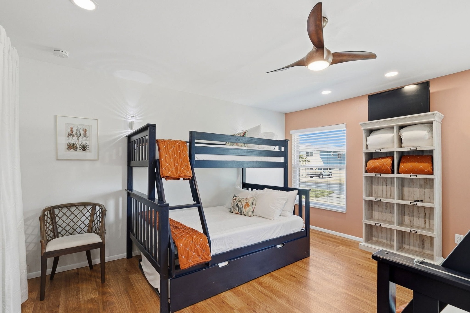 Your kids will love this fun bunk bed room with ample storage and space to play together.