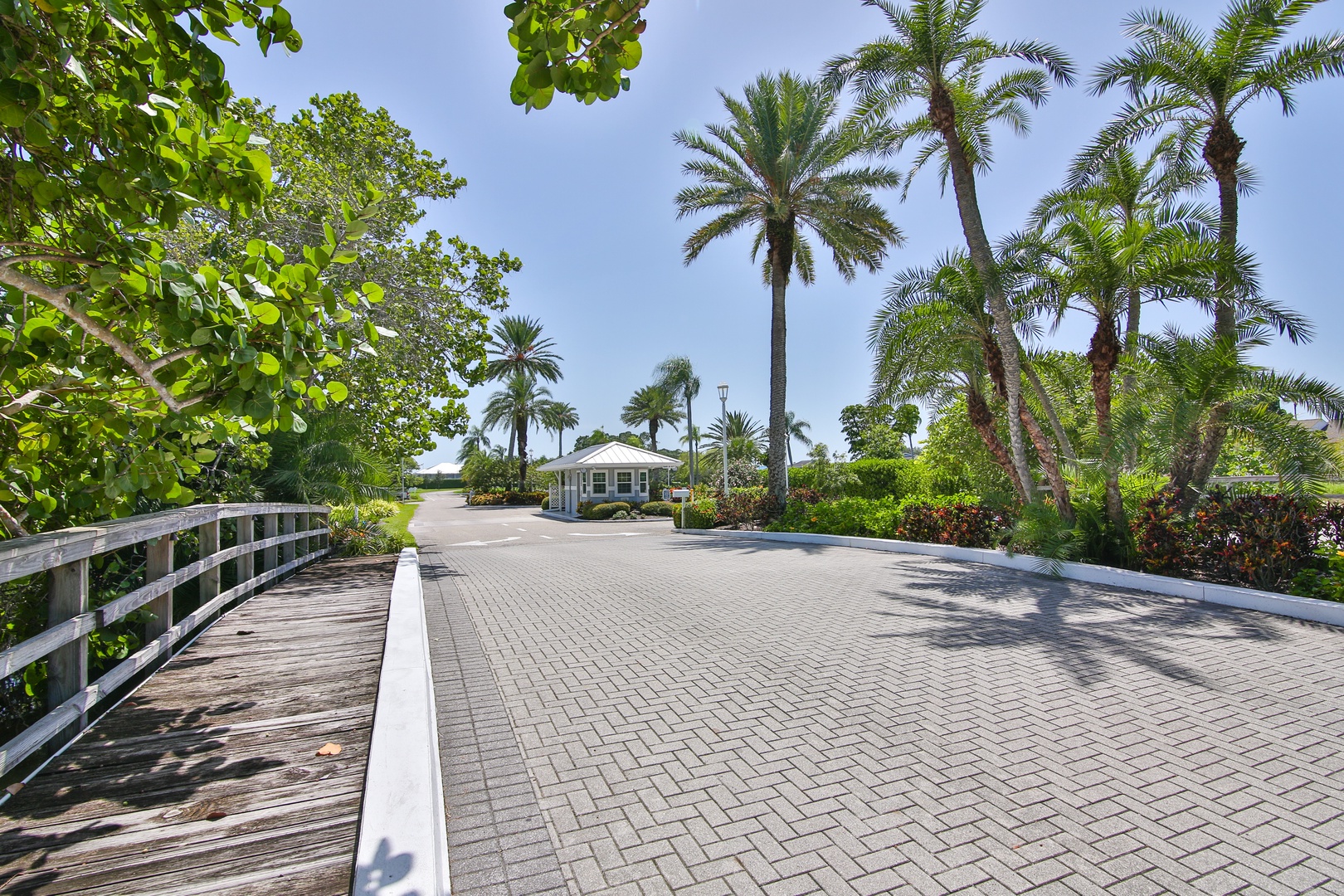 This charming tropical property is nestled among swaying palms and lush greenery, offering a private coastal retreat in a tranquil, sun-drenched setting perfect for your getaway.