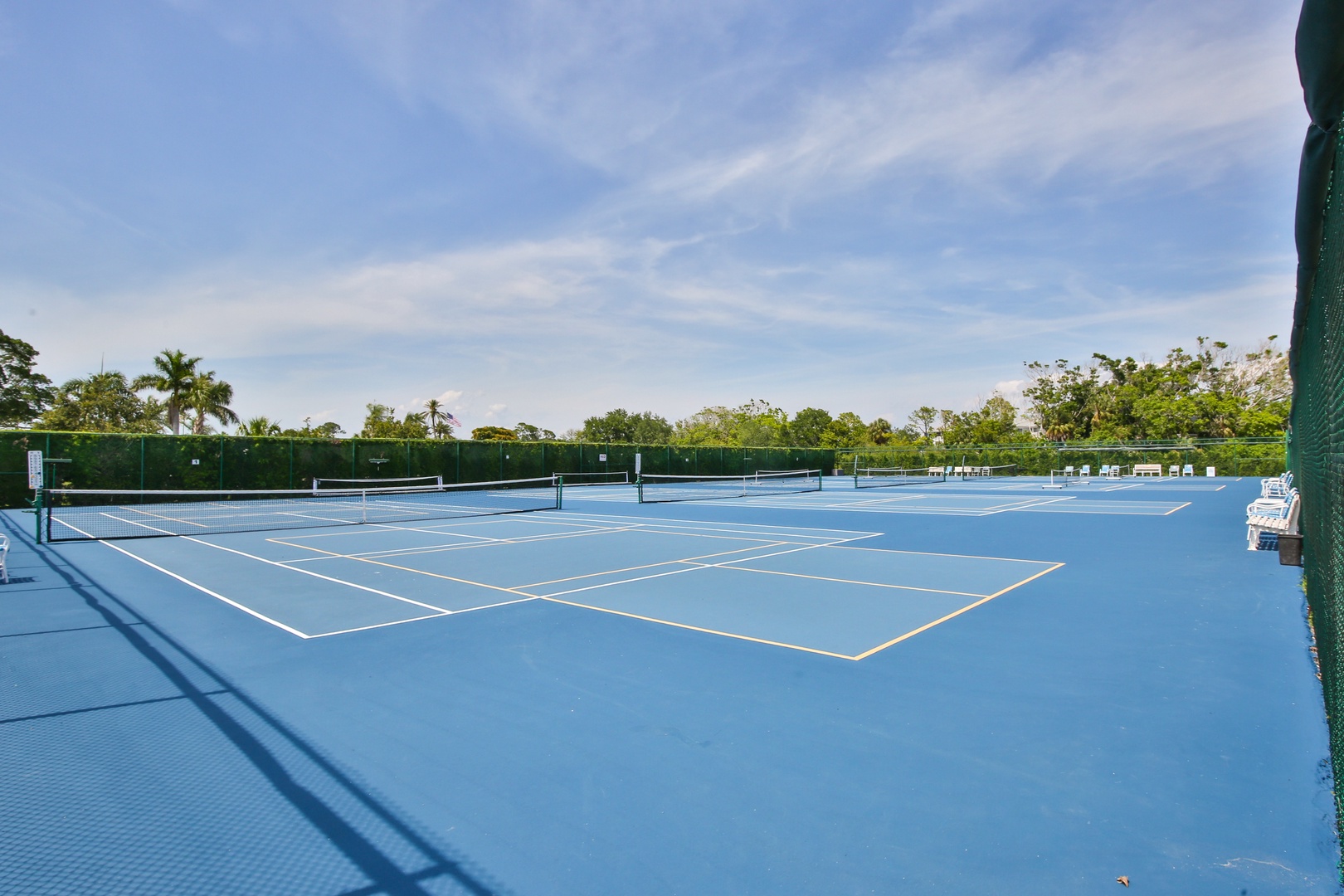 Challenge yourself on pristine tennis courts surrounded by lush tropical landscaping. Perfect for an energizing morning match or casual afternoon game under sunny skies.