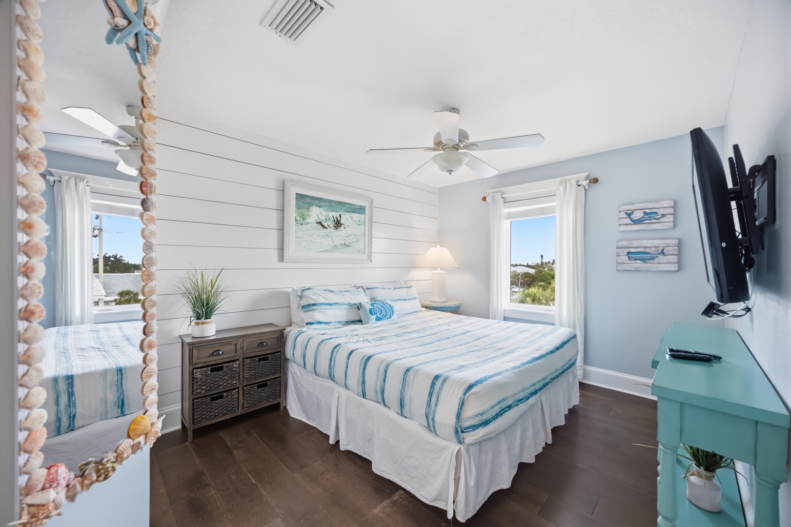 Wake up in your coastal bedroom with ocean breezes and natural light streaming through windows overlooking peaceful surroundings.