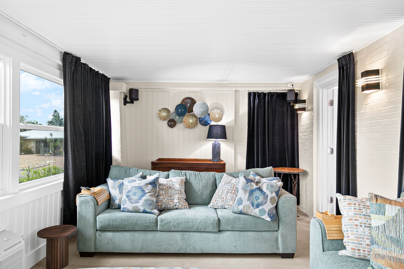 Sink into plush seating surrounded by coastal-inspired décor and natural light streaming through your windows.