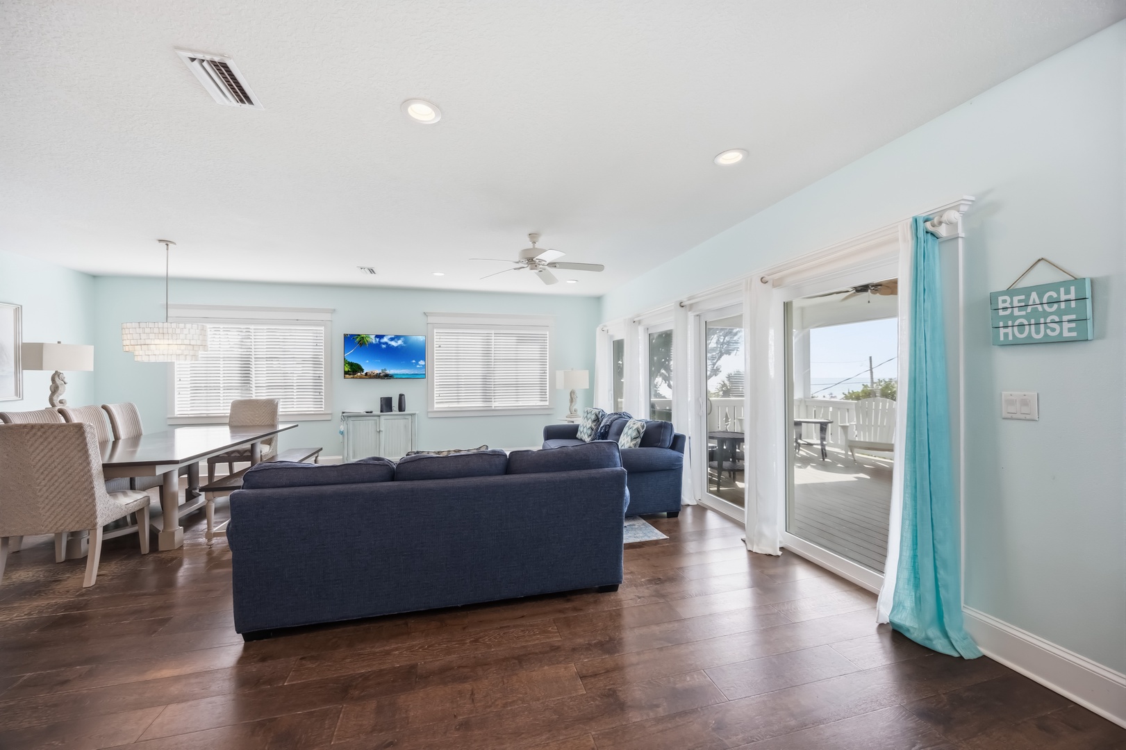 Relax in your airy coastal living space with plush seating, flowing to your private deck for seaside moments.