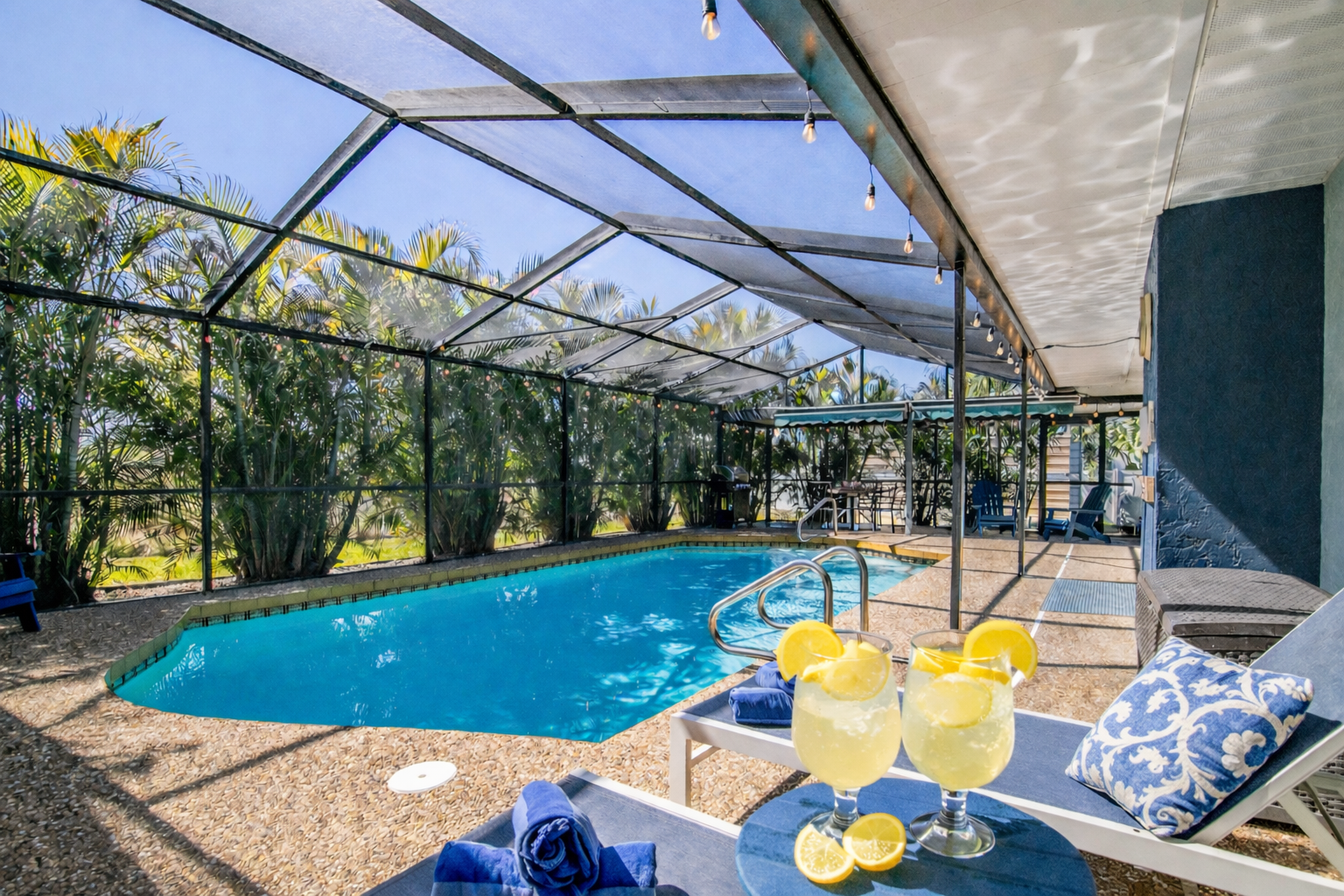 Sip cocktails poolside while enjoying tropical breezes through your private screened oasis.