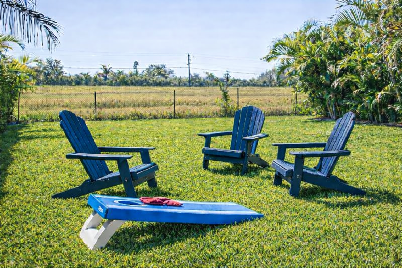Enjoy the spacious backyard with yard games like cornhole—perfect for family fun.