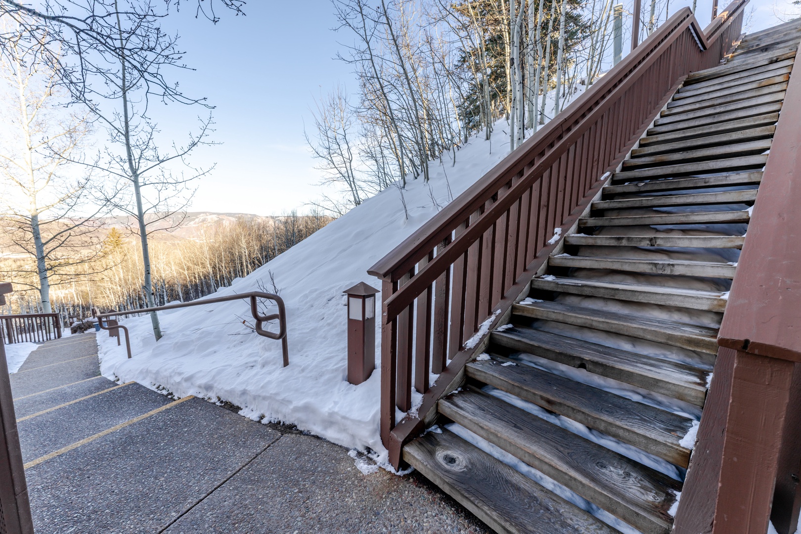 Winter wonderland surrounds the property with pristine snow and mountain views creating a peaceful alpine setting.