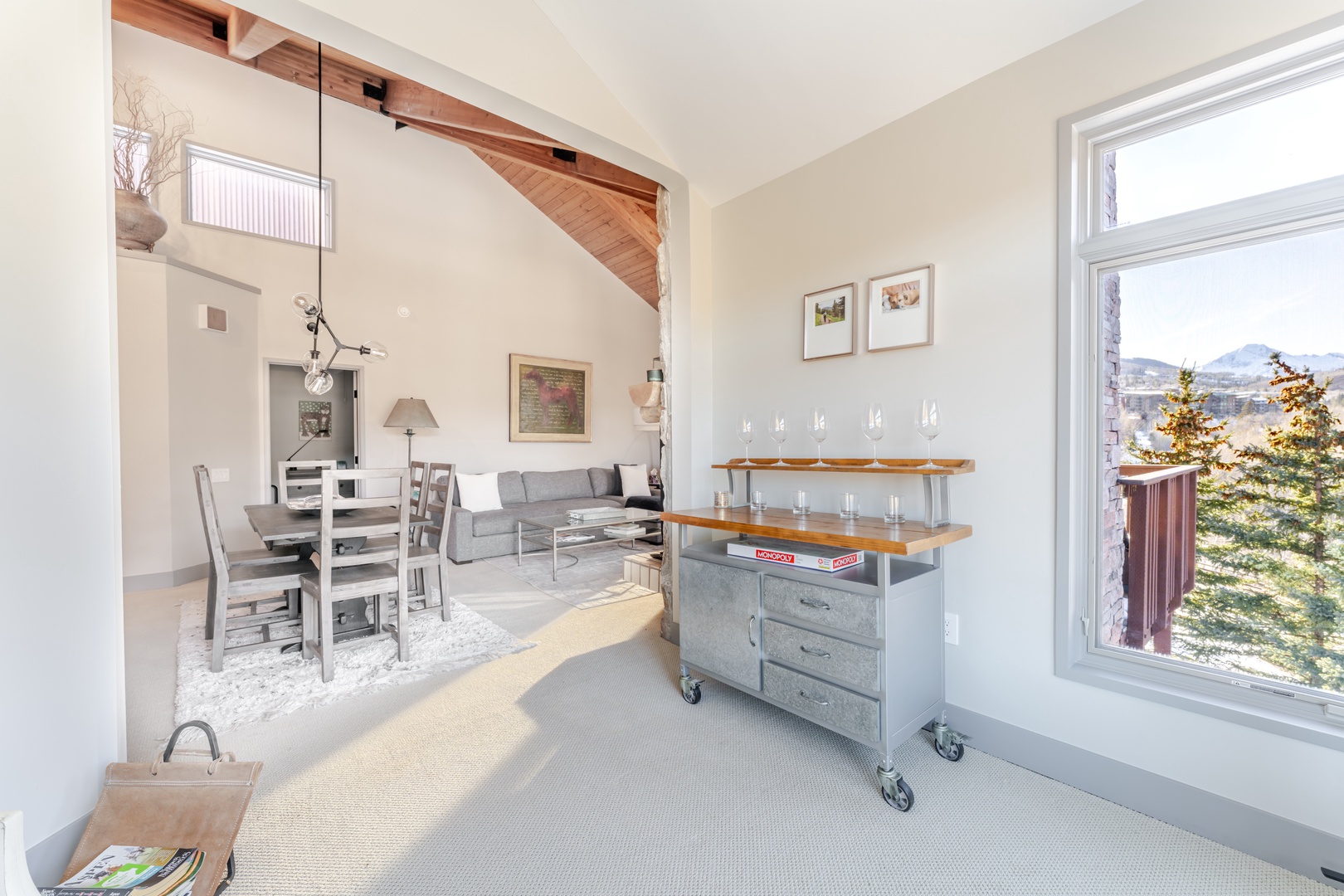 Unwind in your modern retreat with soaring beamed ceilings and mountain views from every window.