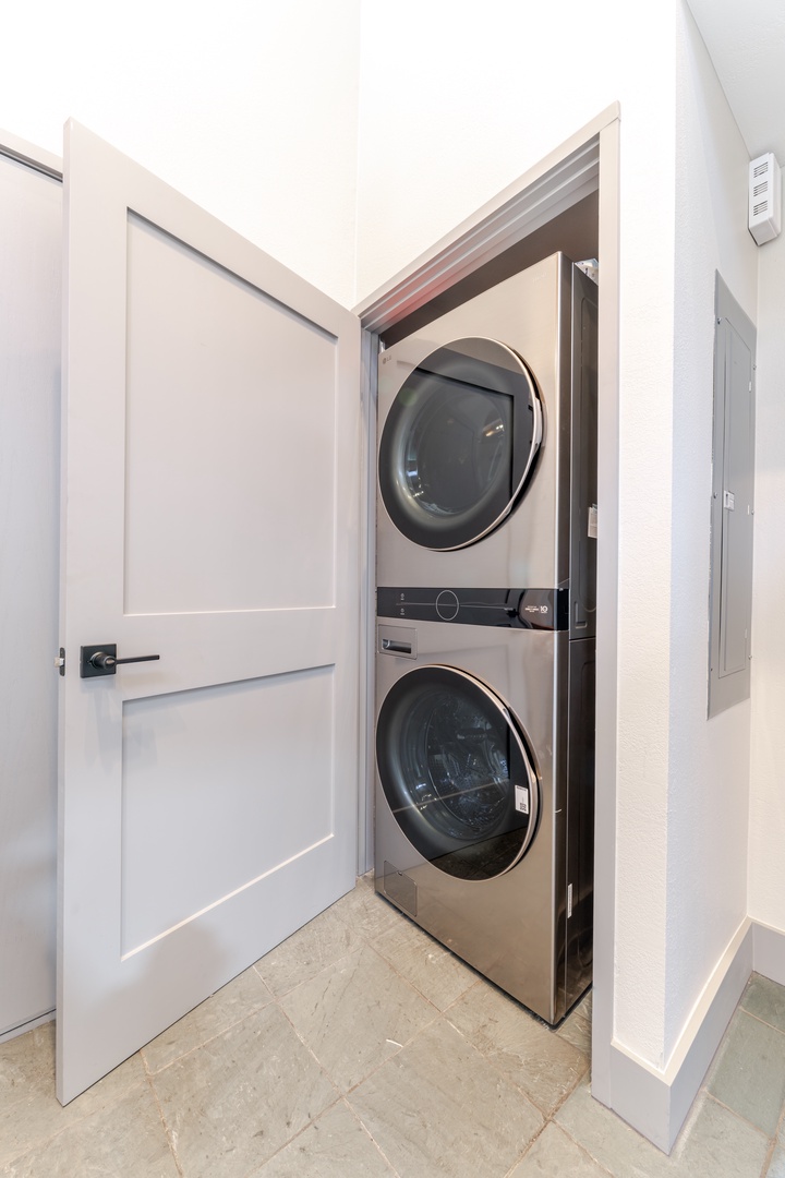 Your in-unit laundry closet features a stacked washer and dryer for ultimate convenience during your stay.