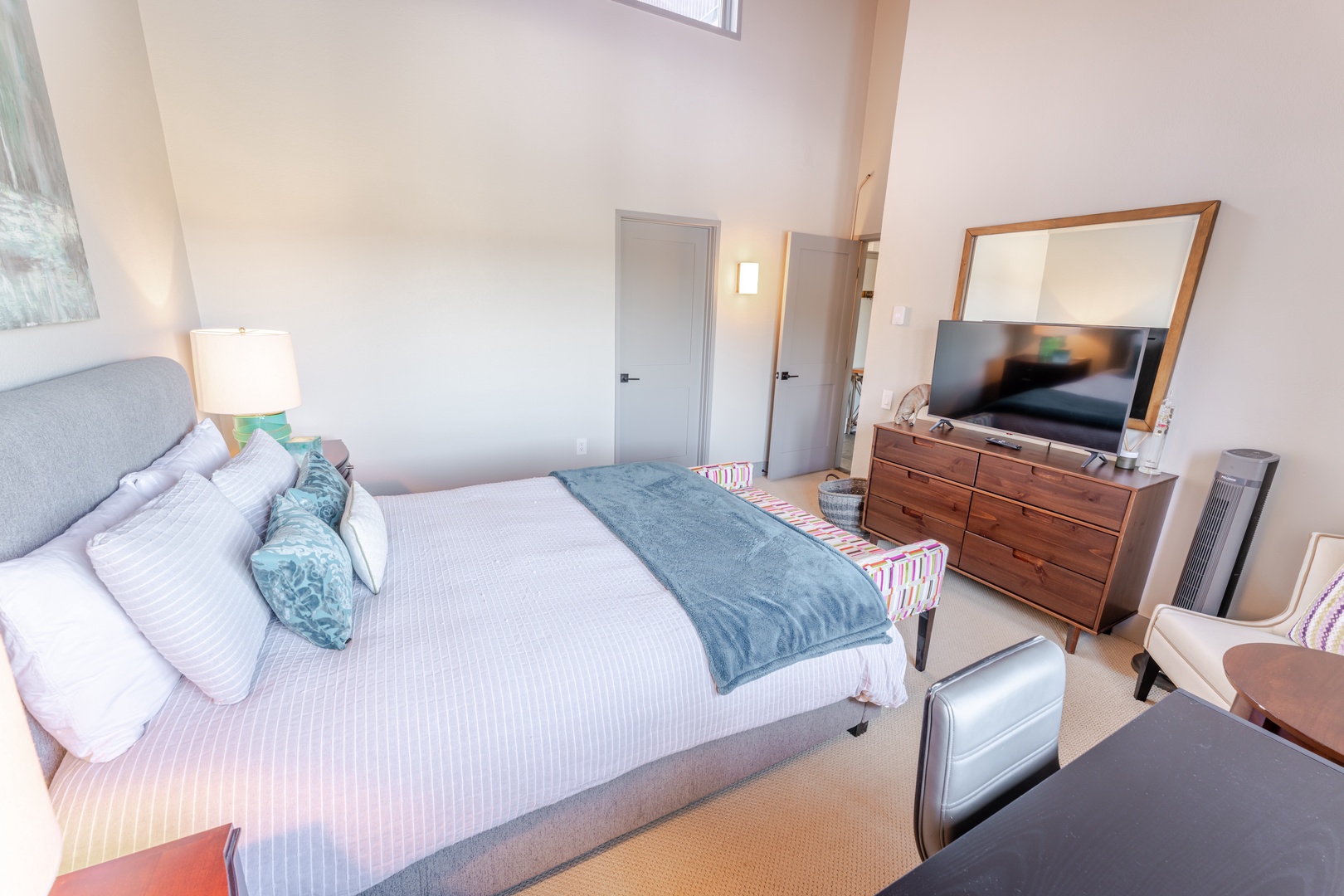 Drift off to dreamland in your serene guest bedroom, featuring crisp linens, modern furnishings, and thoughtful touches for ultimate comfort.