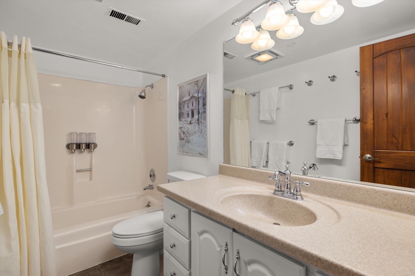 Refresh in your private bathroom with plush towels, ample counter space, and a relaxing tub-shower combo perfect for unwinding.