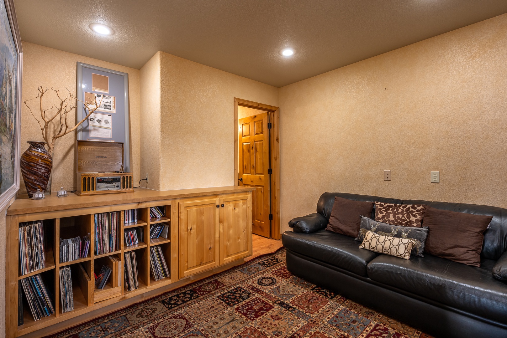 Sink into plush leather seating in your private entertainment room, surrounded by warm wood tones and thoughtful touches that make relaxation effortless.