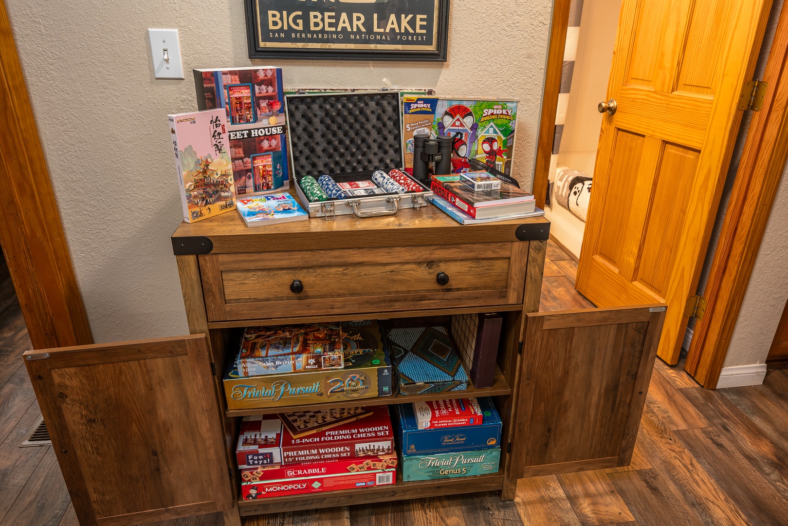 Your game cabinet is fully stocked with puzzles, classic board games, cards, poker chips, and fun activities—perfect for cozy nights in or friendly competition.