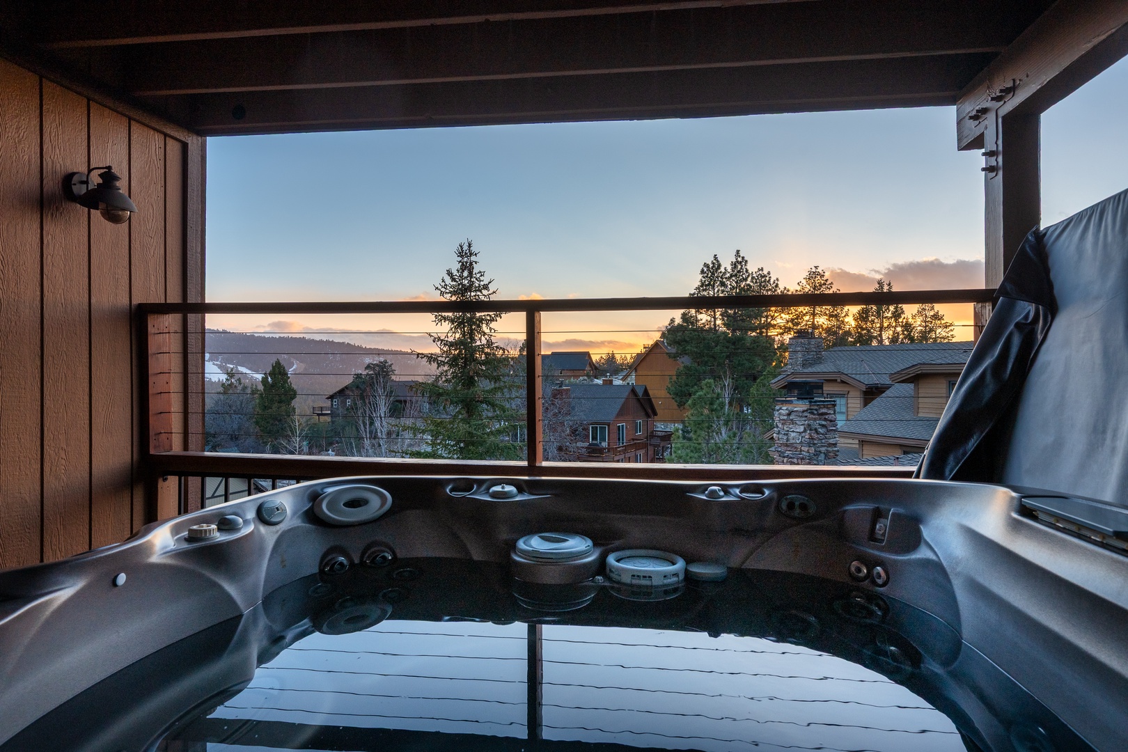 Soak in your private hot tub while watching the golden sunset paint the sky over the peaceful lake and surrounding mountains.
