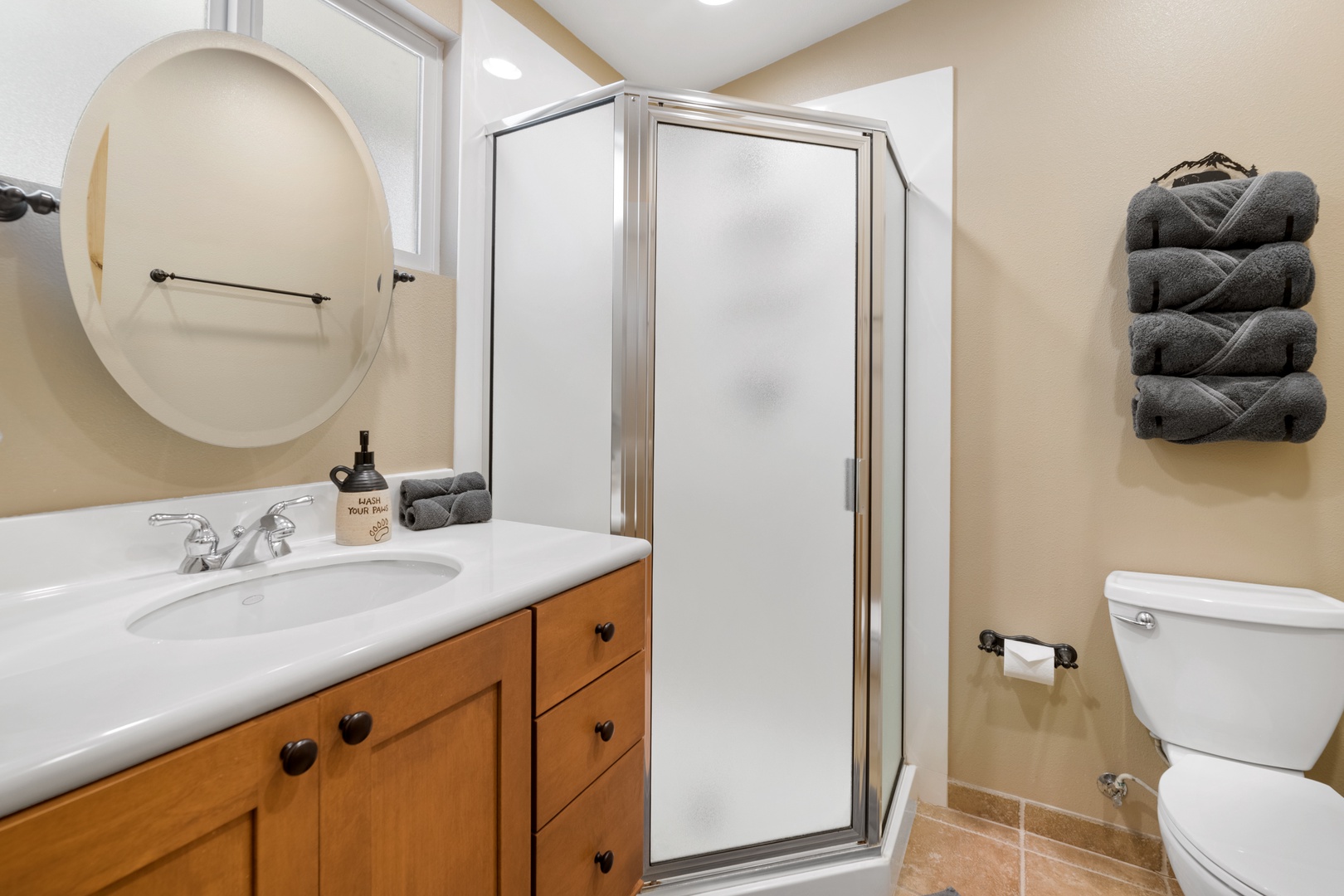 Your private bathroom features a refreshing walk-in shower, a spacious vanity with plenty of counter space, and plush towels ready for you—everything you need to feel right at home.
