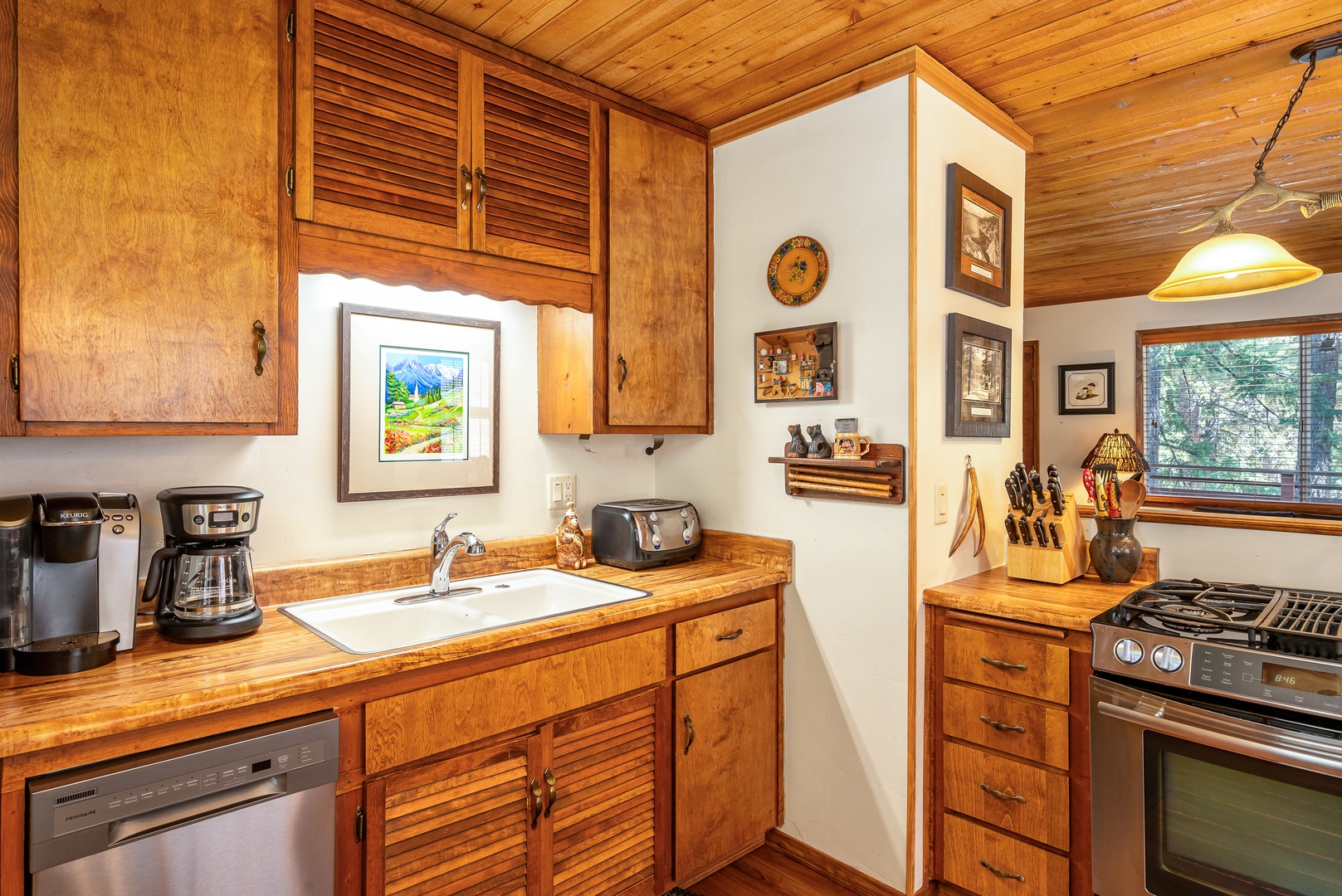 Your fully equipped kitchen features warm wood cabinets, modern appliances, and thoughtful touches that make cooking feel like home.