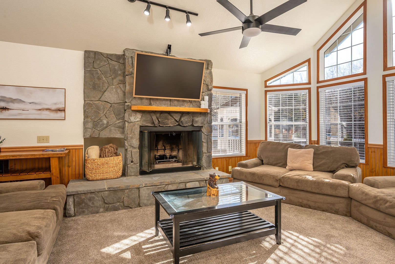 Stunning stone fireplace welcomes you into relaxed luxury and entertainment.