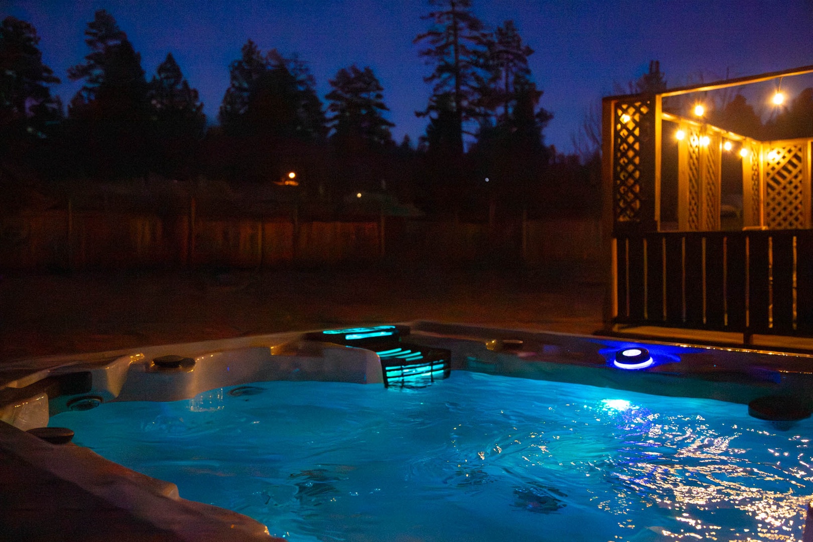 Slip into your private hot tub under starlit skies, where warm bubbling waters and soft lighting create the perfect evening escape.