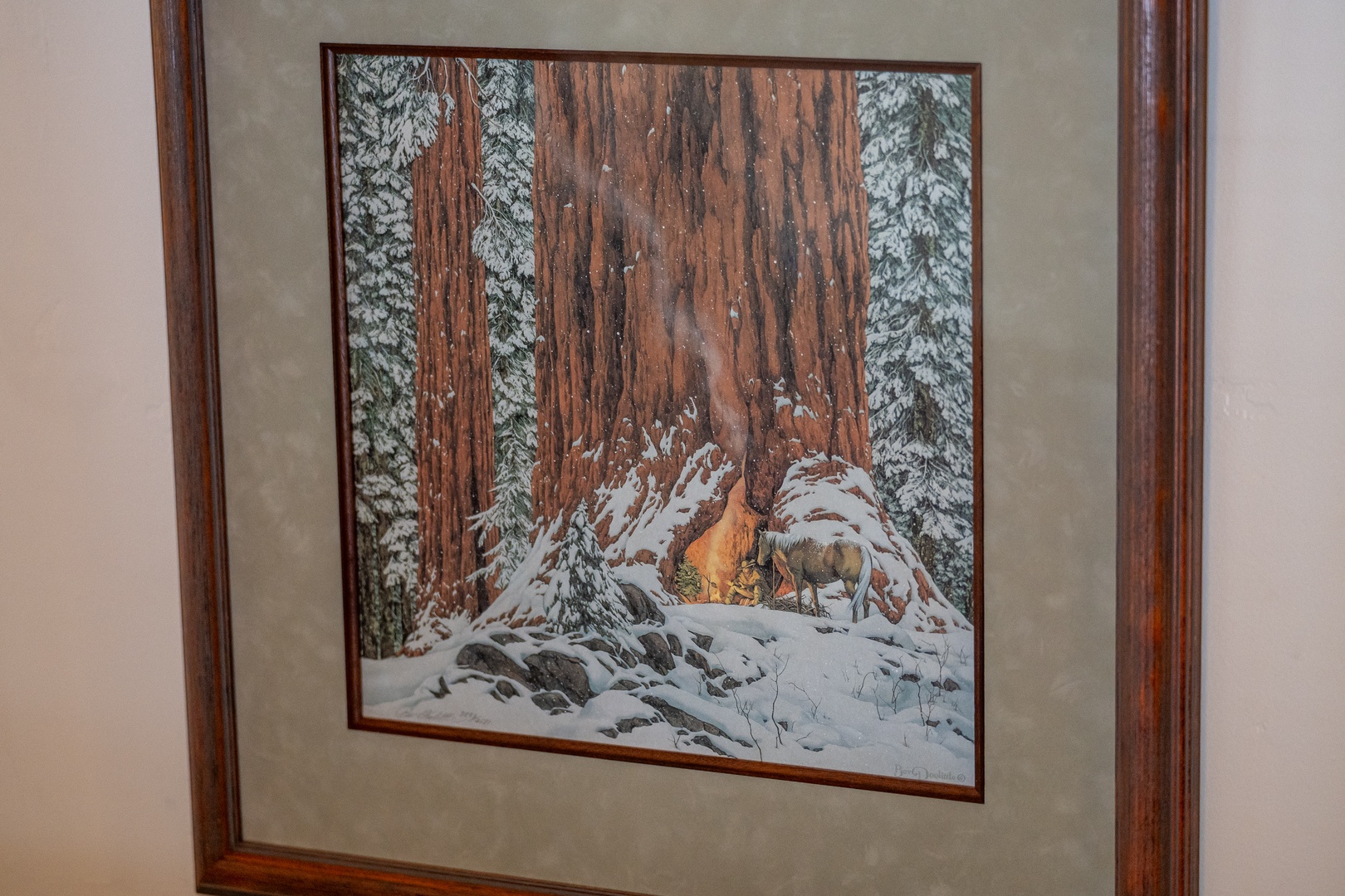 A serene winter scene with wildlife among towering redwoods decorates the wall, adding a touch of nature's beauty to your cozy retreat.