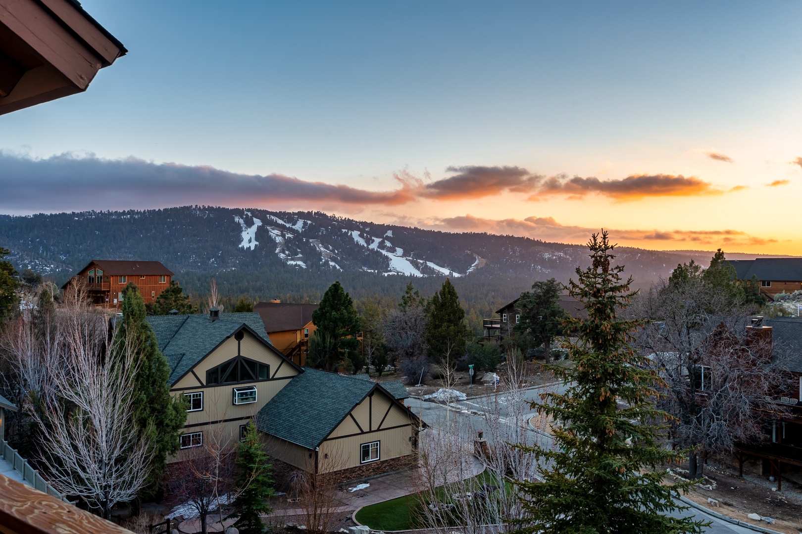 Stunning mountain vista frames this residential area with ski slopes and winter recreation nearby.