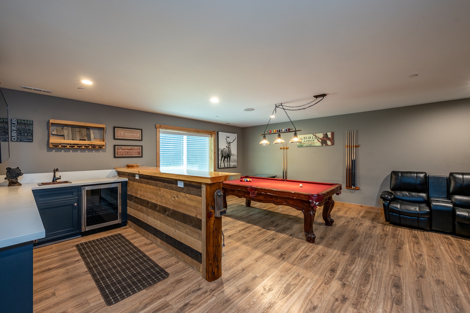 Your private game room awaits with a polished billiard table, cozy leather seating, and a convenient bar area—perfect for unwinding after a day of adventure.