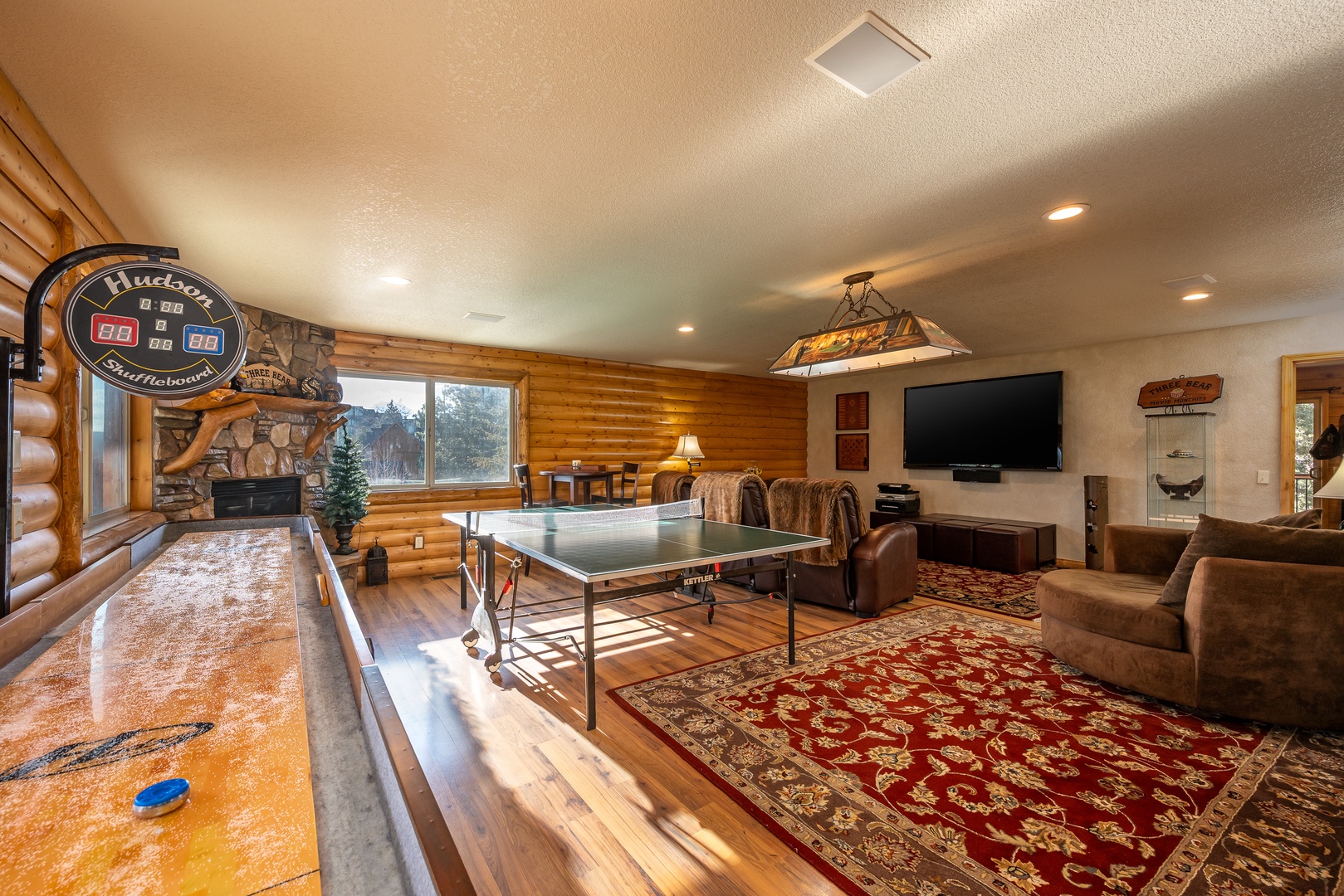 Your perfect game room awaits with shuffleboard, ping pong, and cozy seating where memorable evenings unfold naturally.