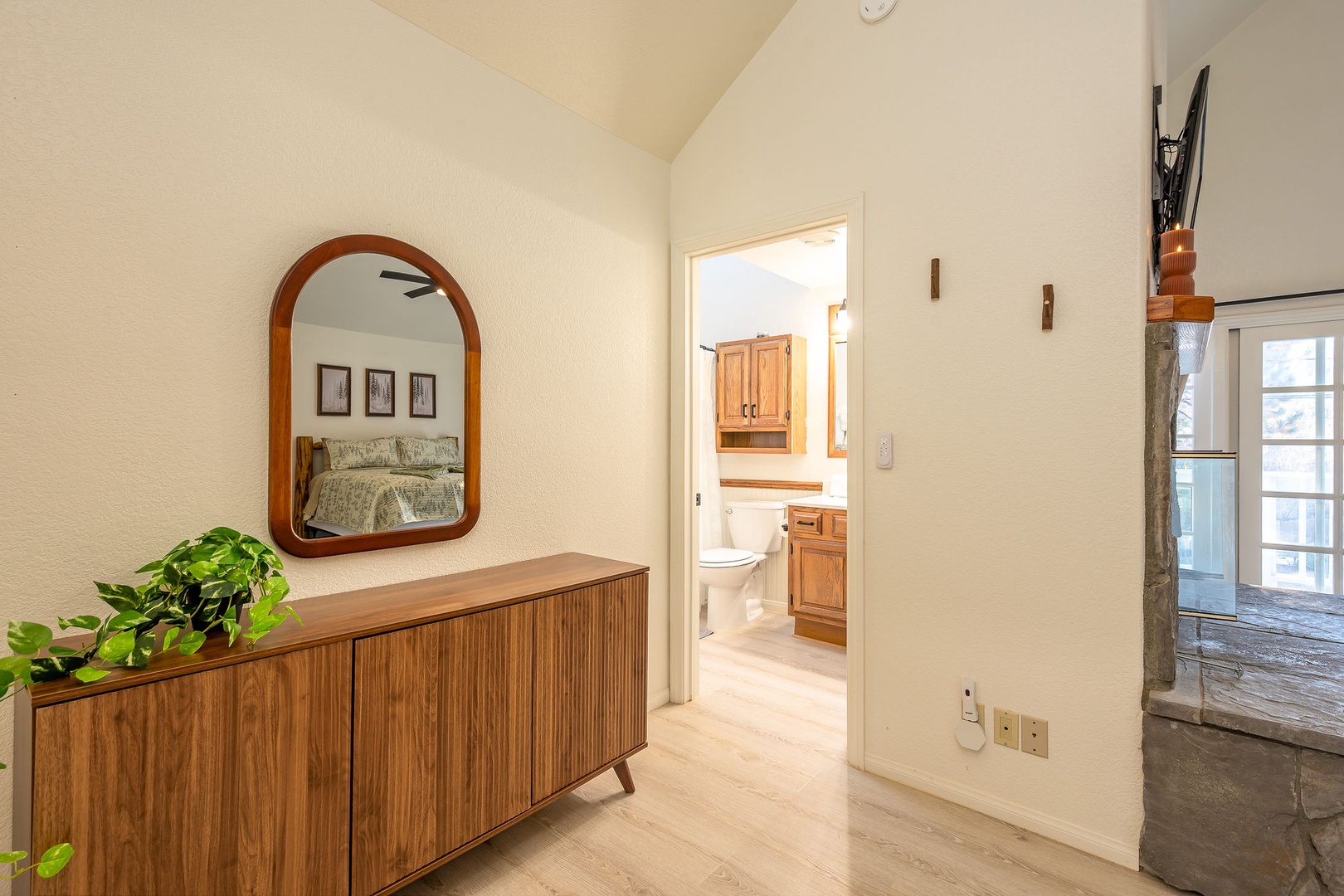 The Master entry features wood furnishings and the entry to the en suite bath