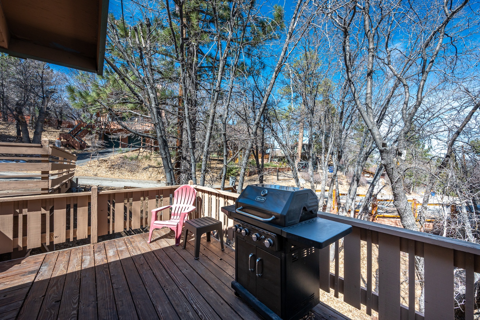 Relax on your private deck with BBQ grill and forest views - perfect for morning coffee or sunset grilling sessions.