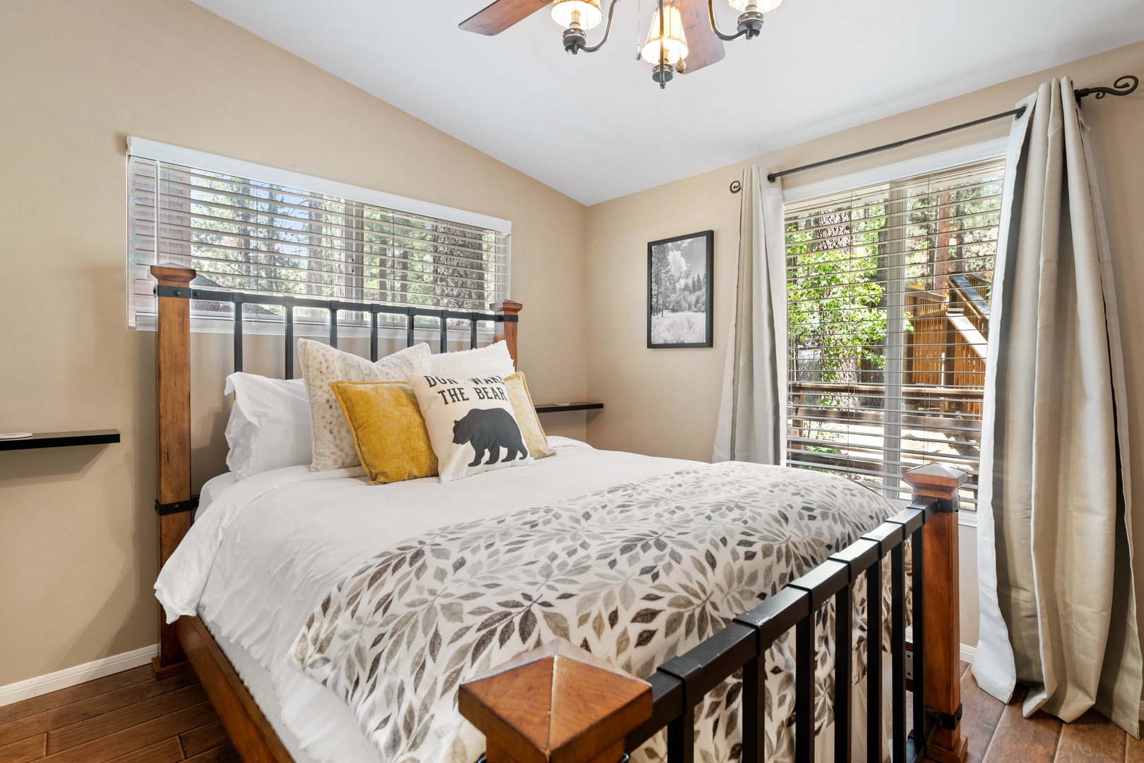 Your cozy retreat awaits with a plush bed, warm natural light, and charming décor. Step outside to your private balcony surrounded by trees for morning coffee or evening relaxation.