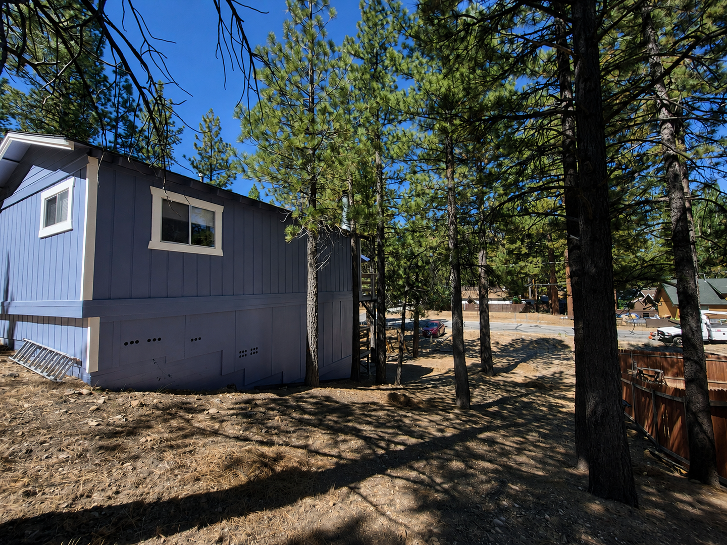 Nestled among tall pines, and located in a peaceful, forested neighborhood.