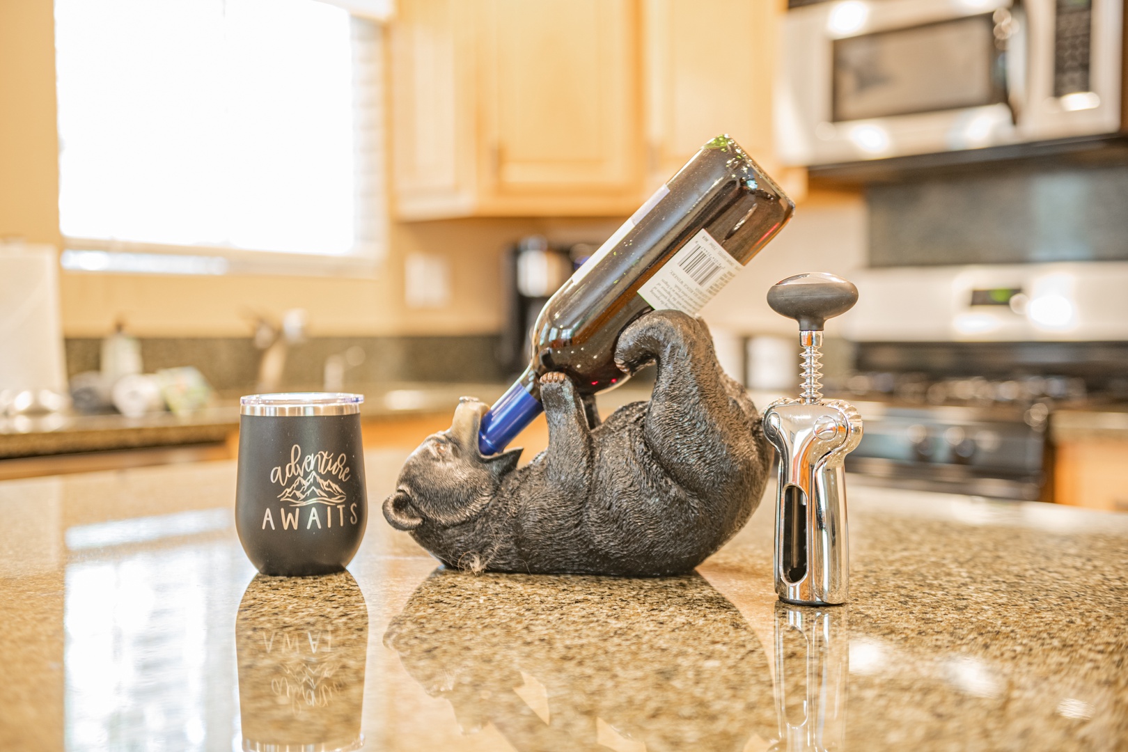 Your fully equipped kitchen welcomes you with a playful touch—adventure awaits as you prepare meals in this bright, modern space with granite countertops and stainless-steel appliances.