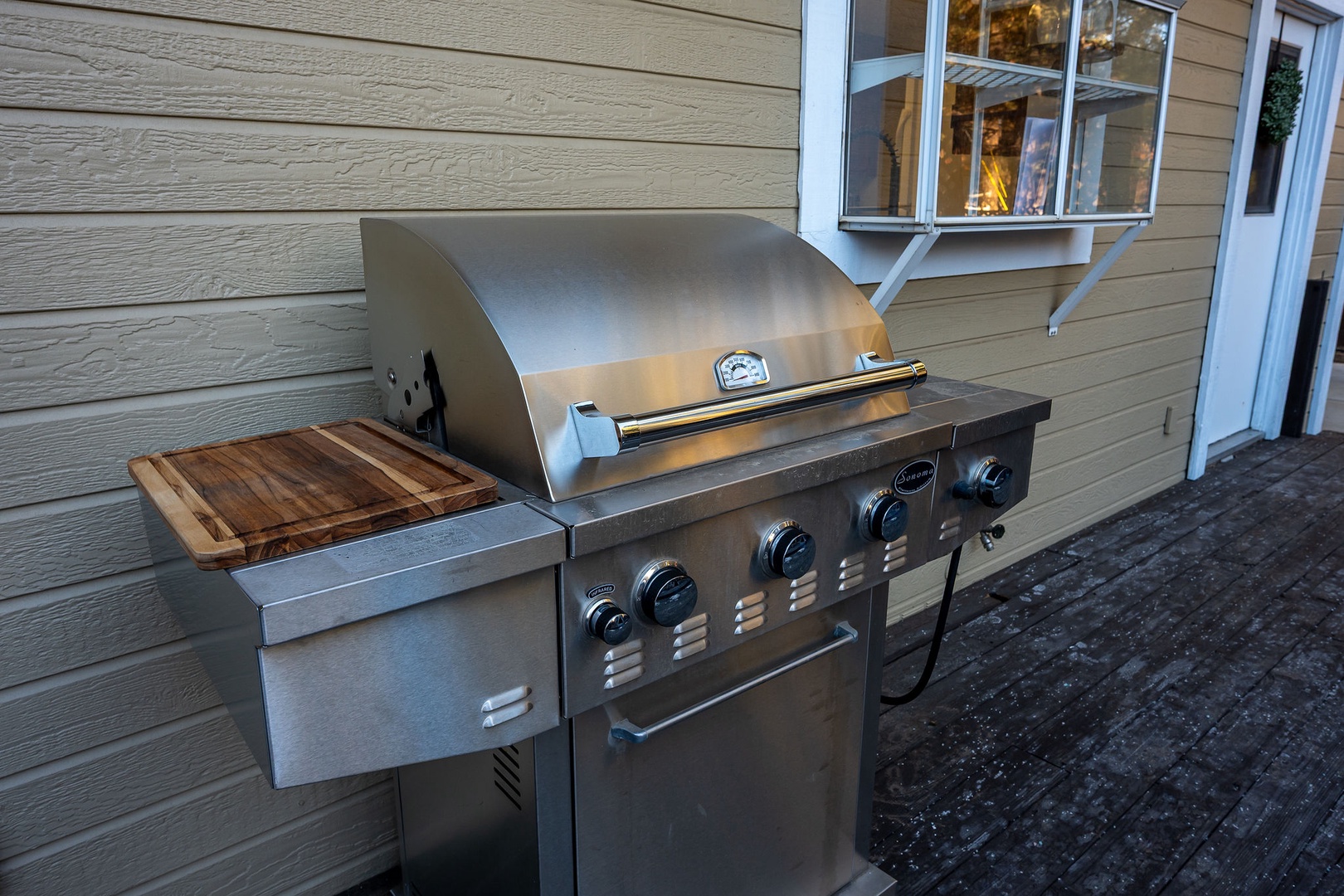 Fire up your culinary adventures with this stainless steel BBQ grill, featuring multiple burners and a convenient prep station for your outdoor cooking needs.