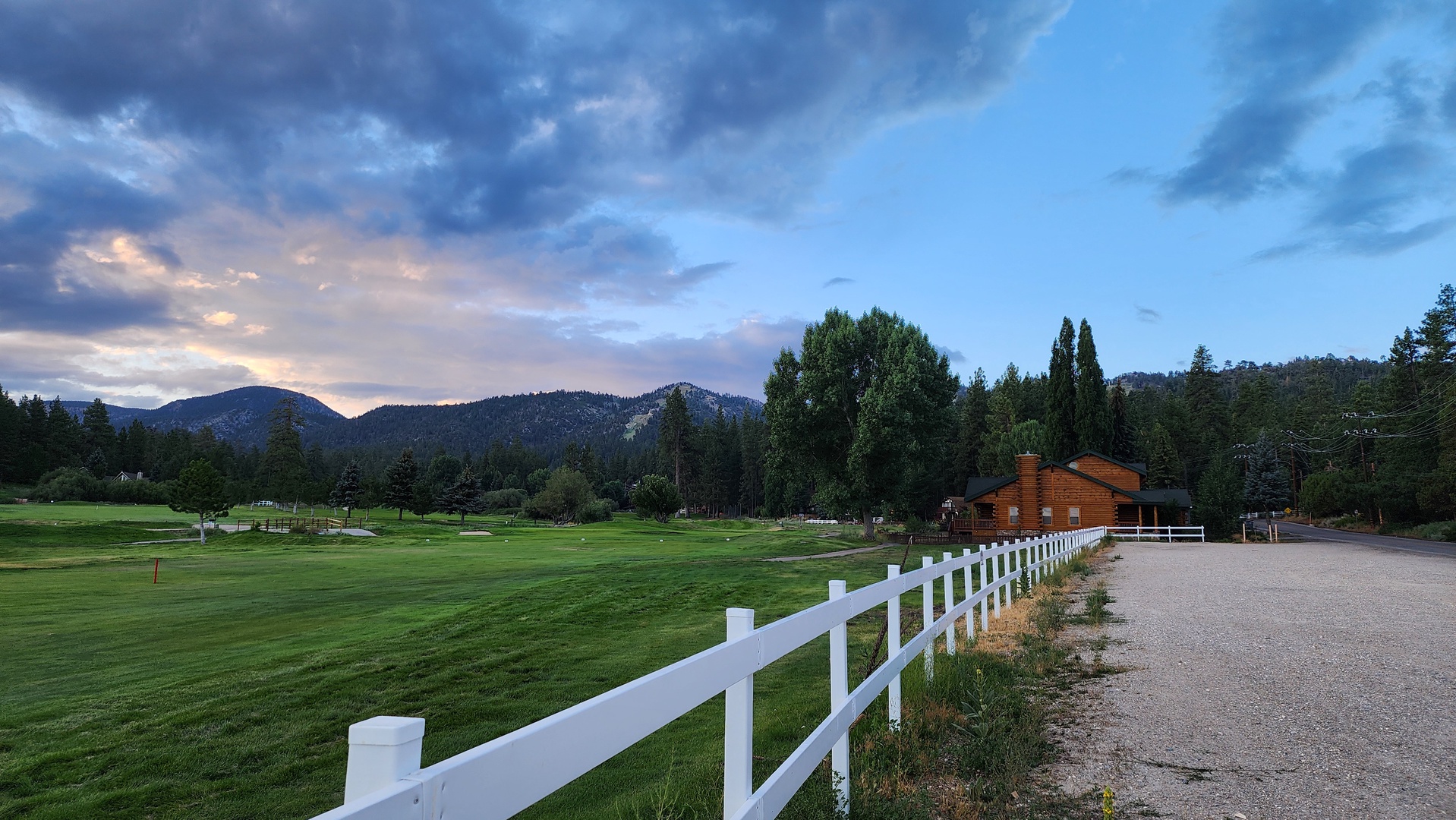 Mountain views frame this peaceful property with manicured grounds and scenic walking paths through the countryside.