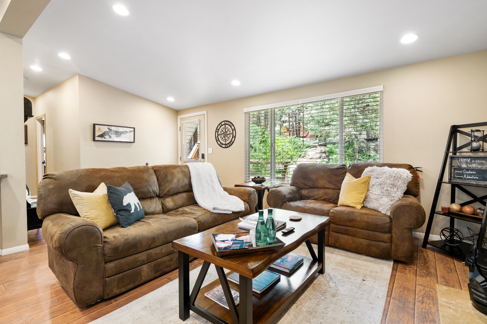 Sink into plush sofas with a good book or your favorite show—this cozy living room invites you to unwind with garden views and warm natural light.