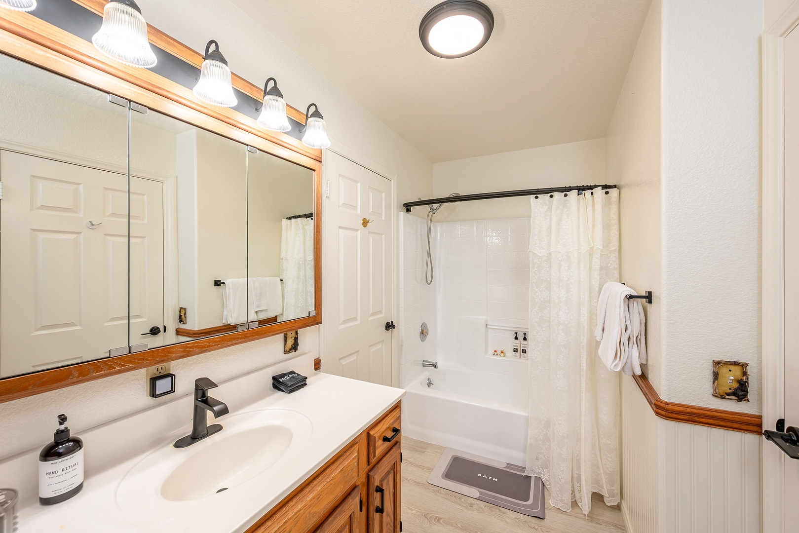 Unwind in your private bathroom featuring a relaxing tub-shower combo and vanity with premium amenities.