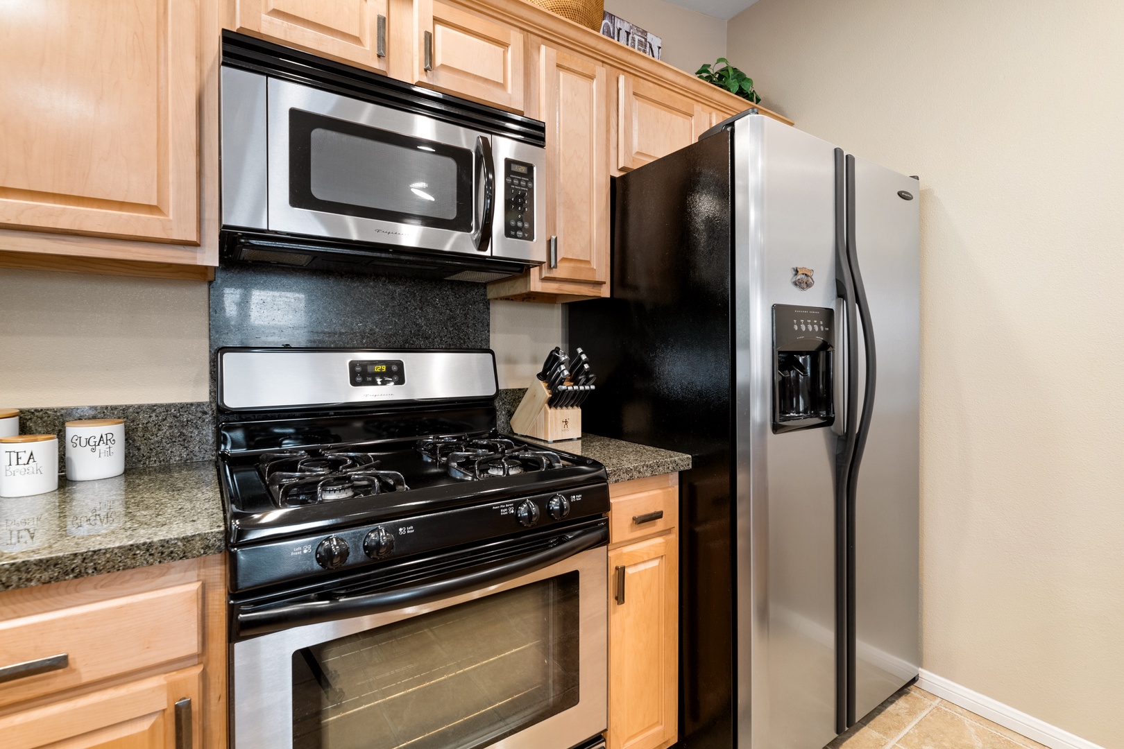 Your fully equipped kitchen features modern stainless steel appliances, granite countertops, and ample cabinet space—everything you need to prepare meals during your stay.