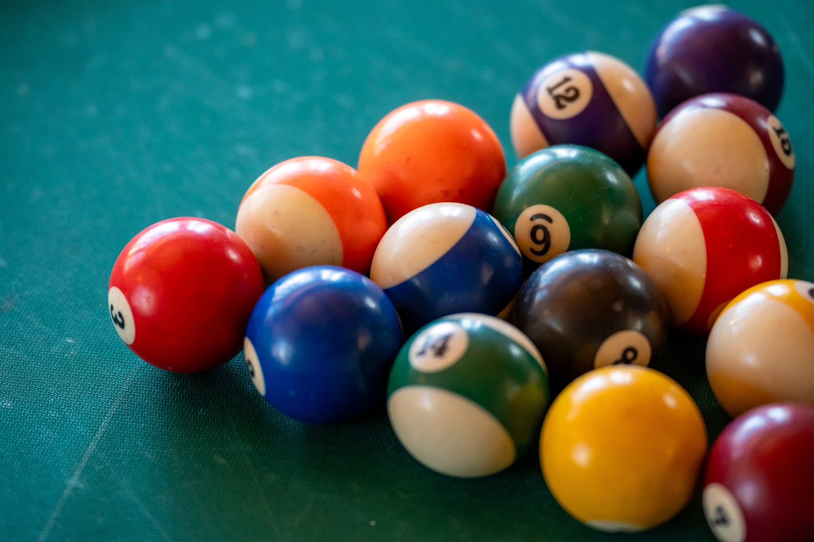 Challenge friends to a game of pool on the beautiful green felt table with professional-quality balls ready for your next shot.