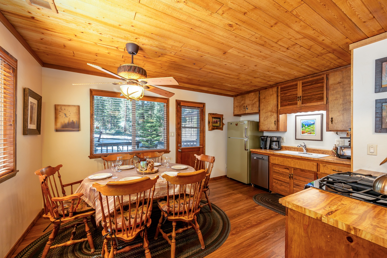 Gather around this rustic dining table where warm wood tones create a cozy atmosphere for your mountain meals together.