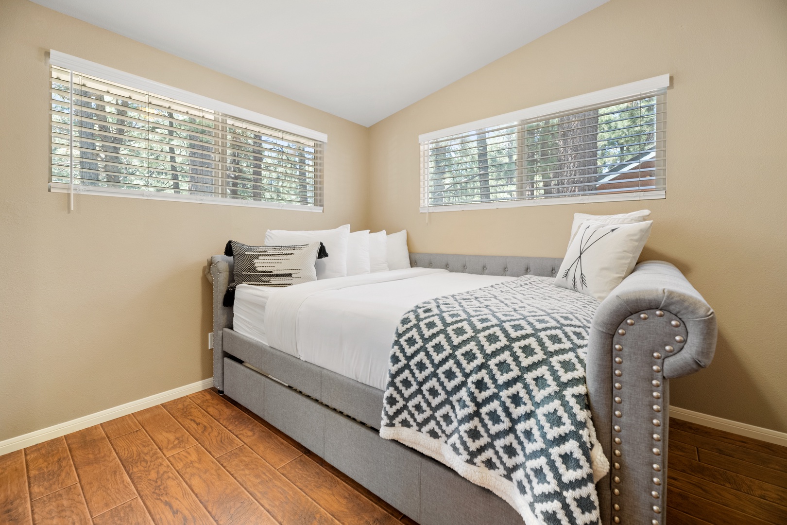 Drift off in your cozy bedroom with plush linens and soft natural light filtering through the windows, creating a peaceful retreat after a day of adventure.