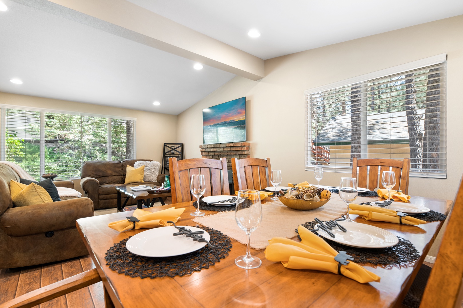 Gather around this beautifully set dining table where you'll create memorable meals together, then unwind in the cozy living area bathed in natural light.