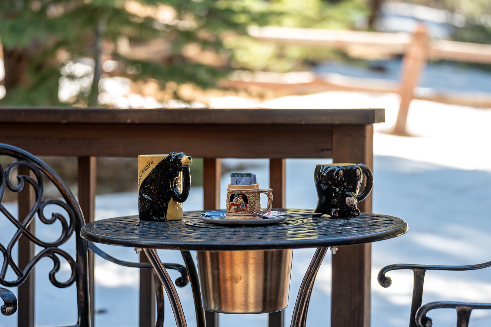 Your morning coffee awaits at this charming poolside table, where gentle breezes and dappled sunlight create the perfect breakfast spot.