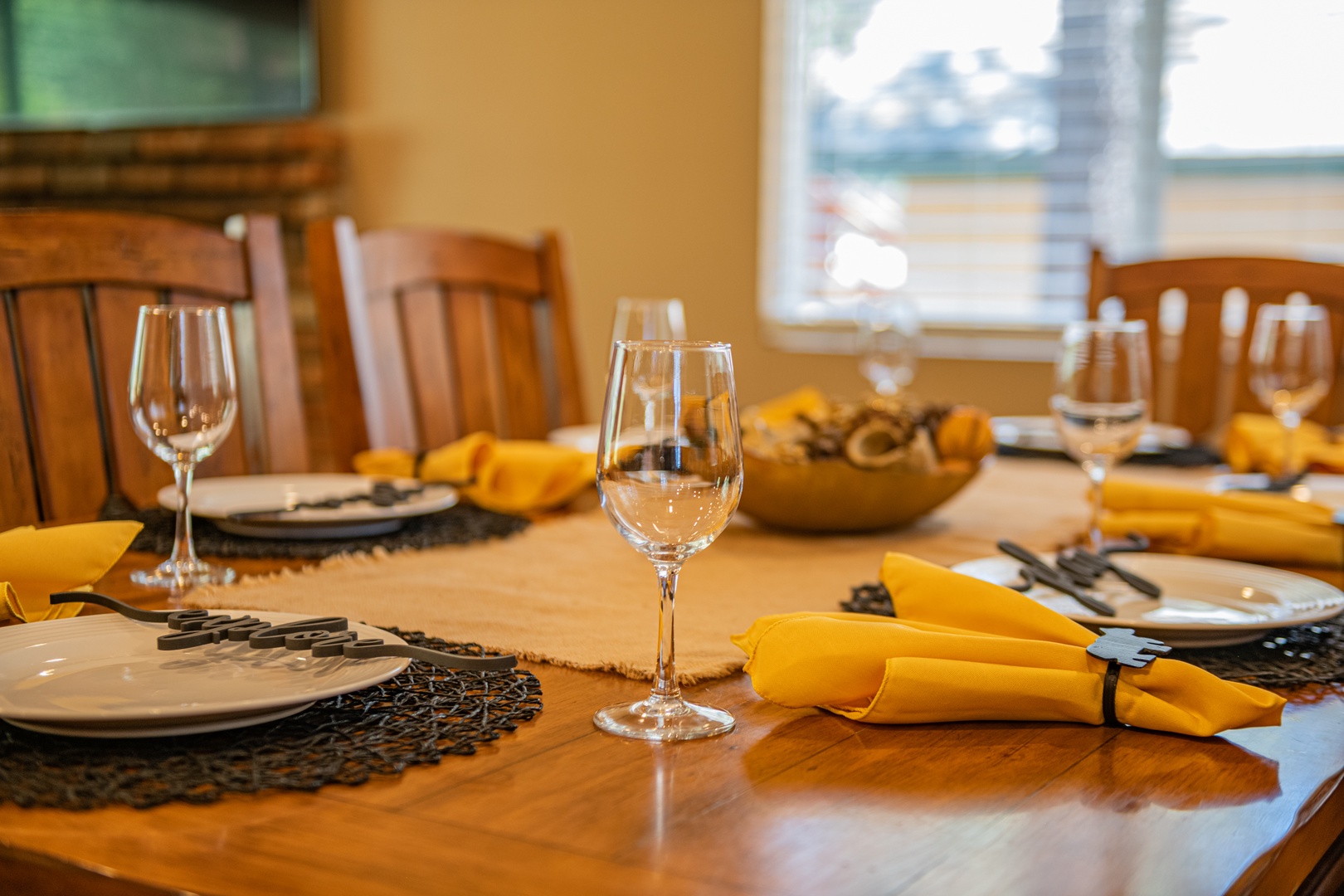 Your dining table is beautifully set with bright yellow napkins, sparkling glassware, and elegant place settings—ready to host memorable meals with loved ones.