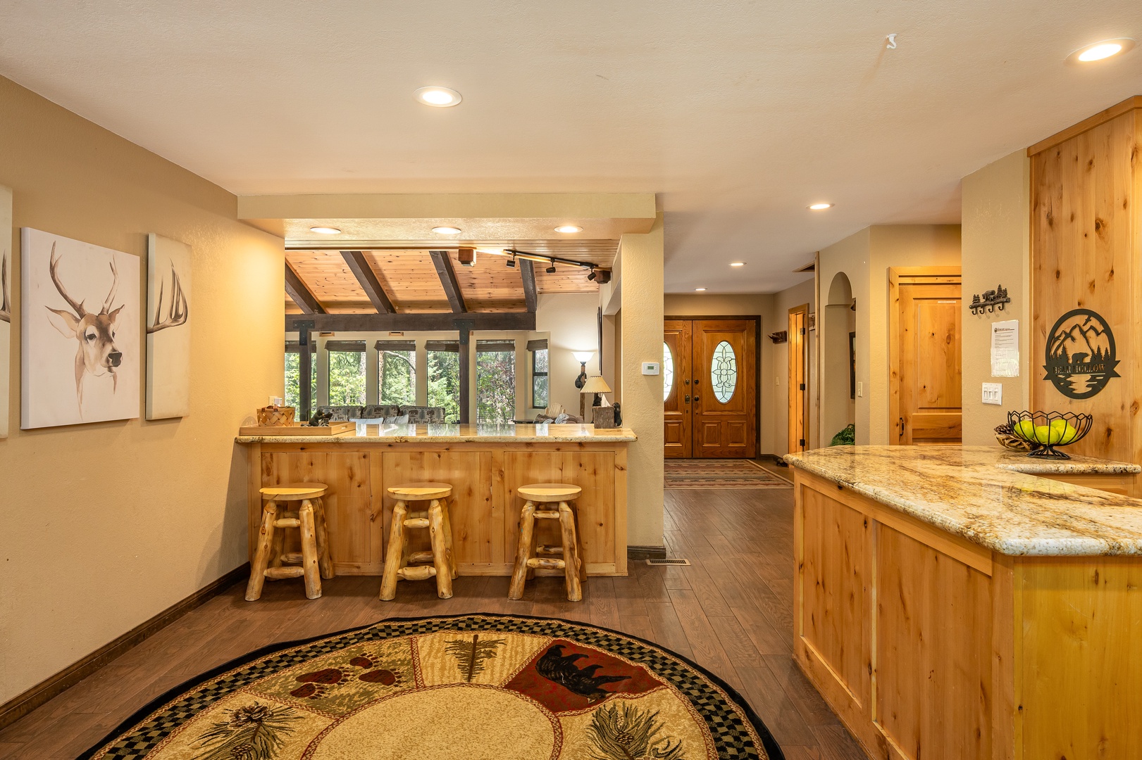 You'll love the warm, rustic charm of this inviting kitchen and dining space, where natural wood and mountain-inspired accents create the perfect setting for your morning coffee or evening gatherings.