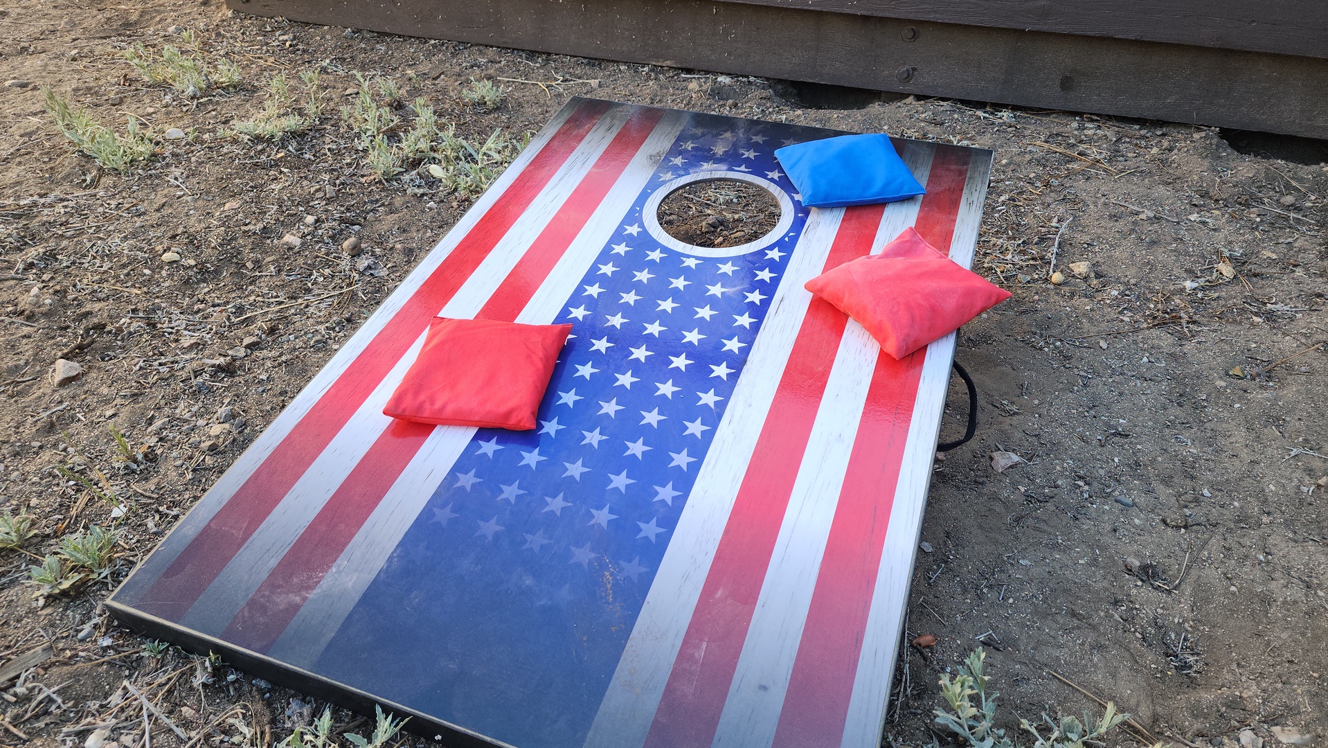 Challenge everyone in your group to a friendly game of cornhole - who wins the prize?